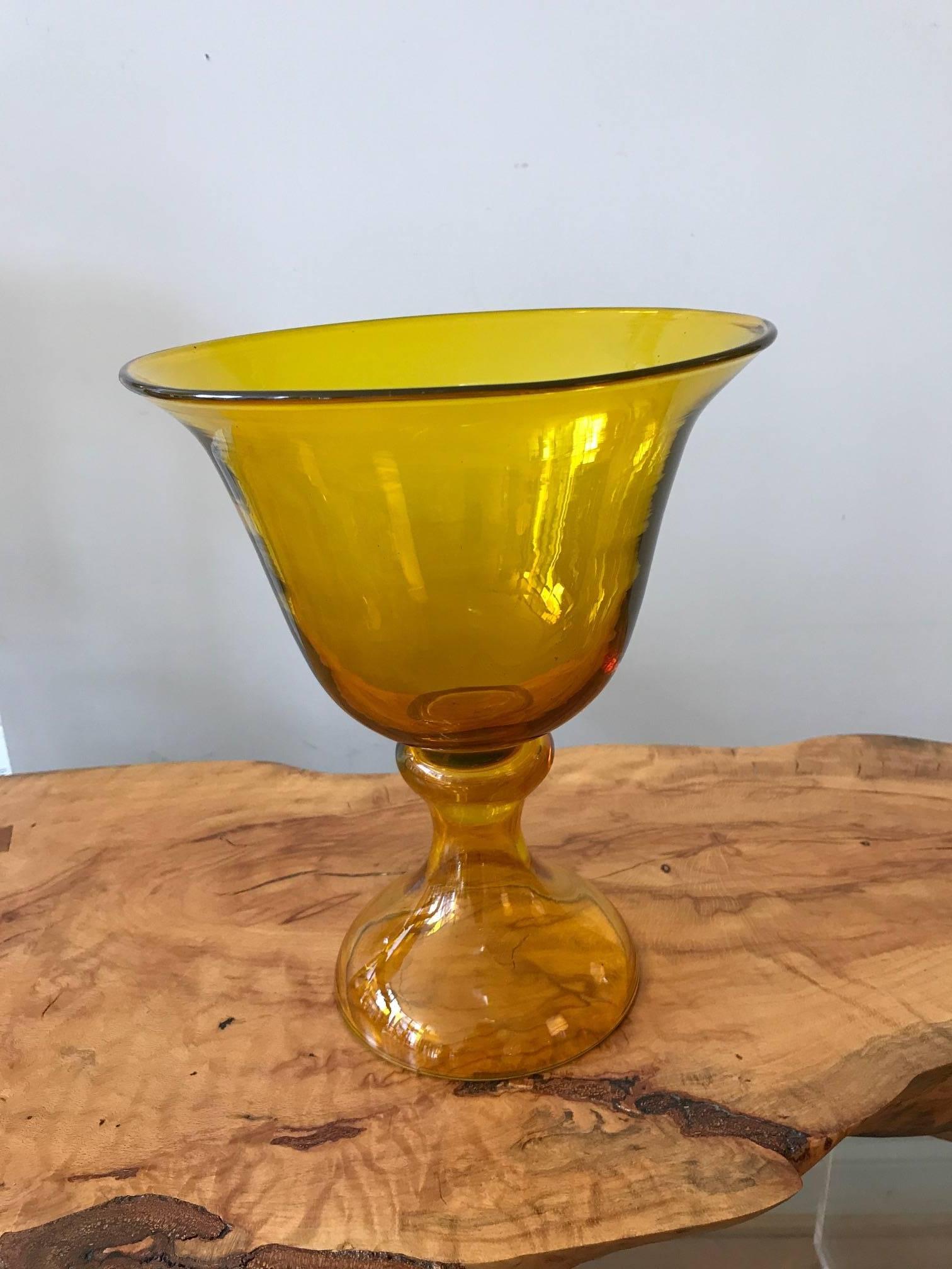 A large glass chalice form Blenko pedestal vase.