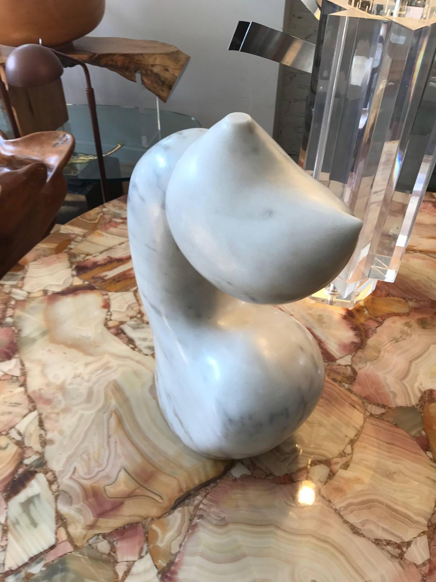 Abstract biomorphic marble sculpture by Mario DeNoto. The work is signed Denoto 64. The work is carved out of white Carrara marble with grey veining throughout. Very much in the style of the organic works Henry Moore and Barbara Hepworth. Intriguing