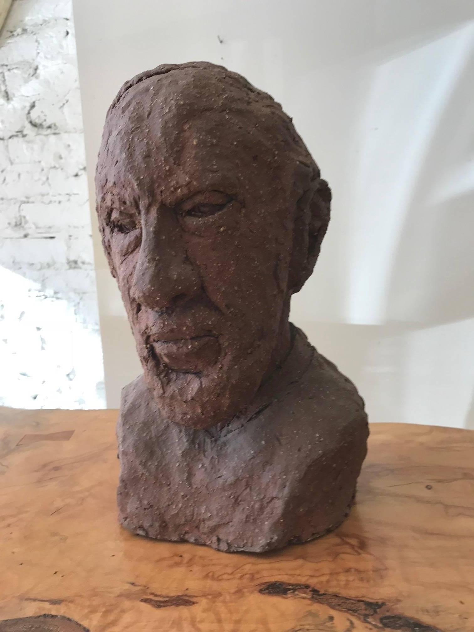 Wonderful rustic unglazed terracotta bust of a man by Joyce Pines a graduate of the Art Institute of Chicago. Pines studied under famed Czech sculptor Albin Polasek.  Intriguing ceramic decorative object from every angle.