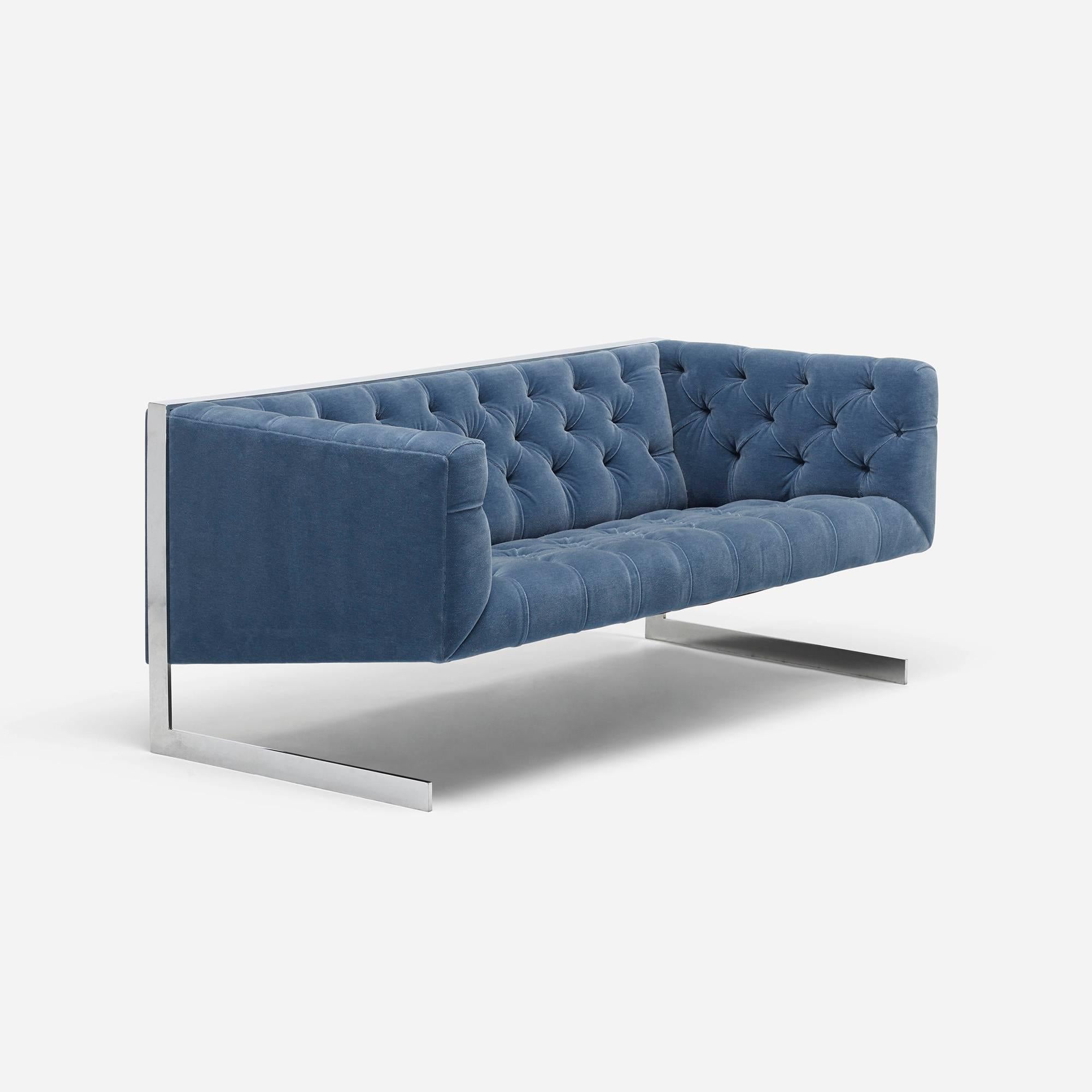 This stunning cantilevered settee by Milo Baughman has been expertly updated in a cool blue mohair fabric. With a generous seat and small footprint this eye-catching piece is perfect for small spaces.