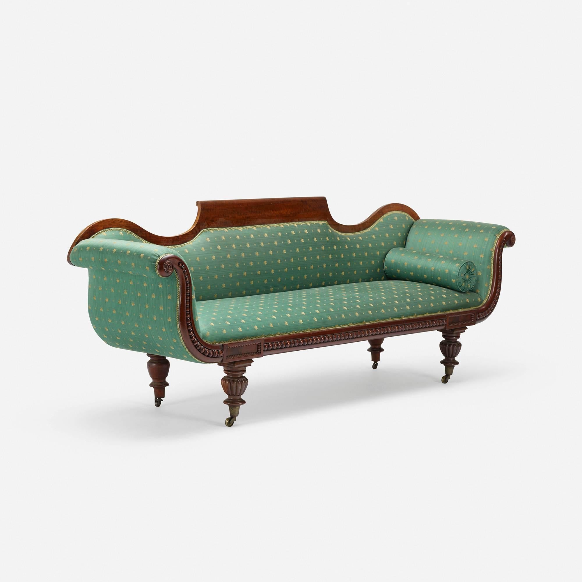 Curvaceous, stylish turned leg sofa from the 19th century.