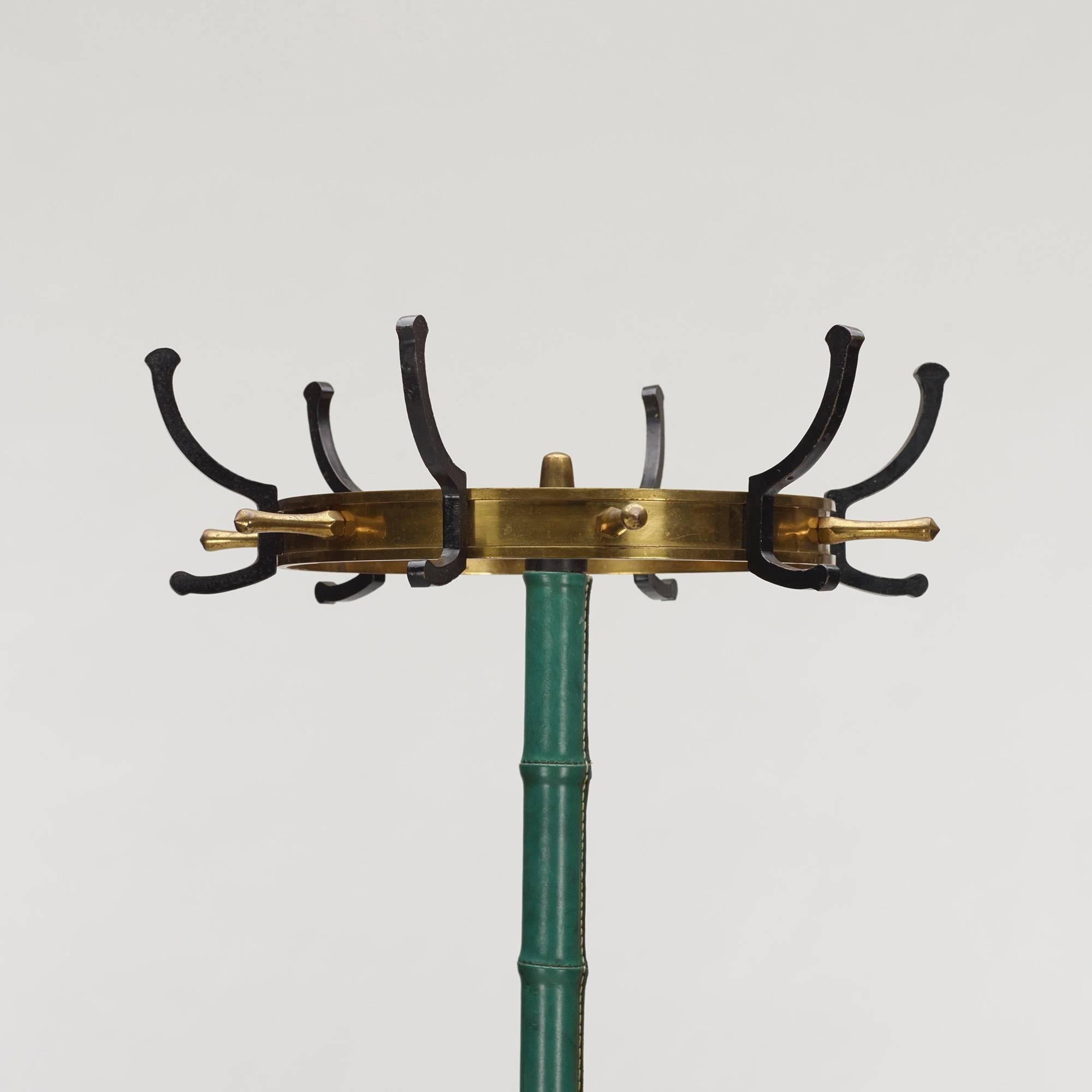 Leather wrapped coat rack by Jacques Adnet.