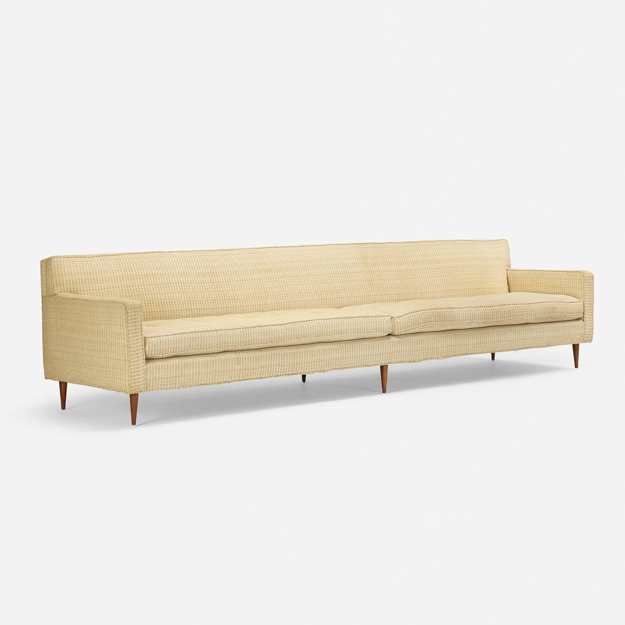 This custom sofa for Directional features an extra-long length at 122