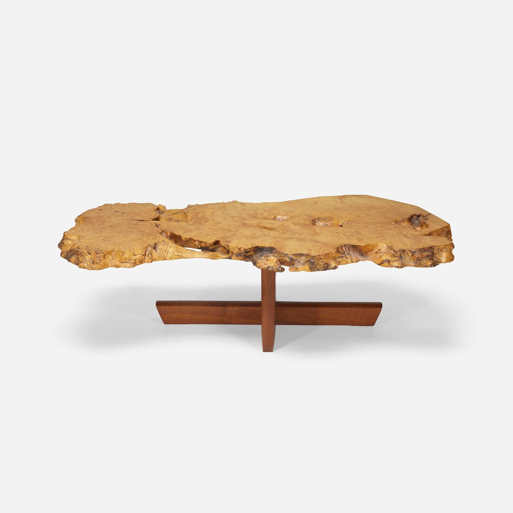 George Nakashima hand-selected this special, figured tabletop at the request of the original owners. The expressive and unusually thick slab top displays numerous fissures, recesses, burls, knots, continuous free edge and a naturally formed 'bridge'