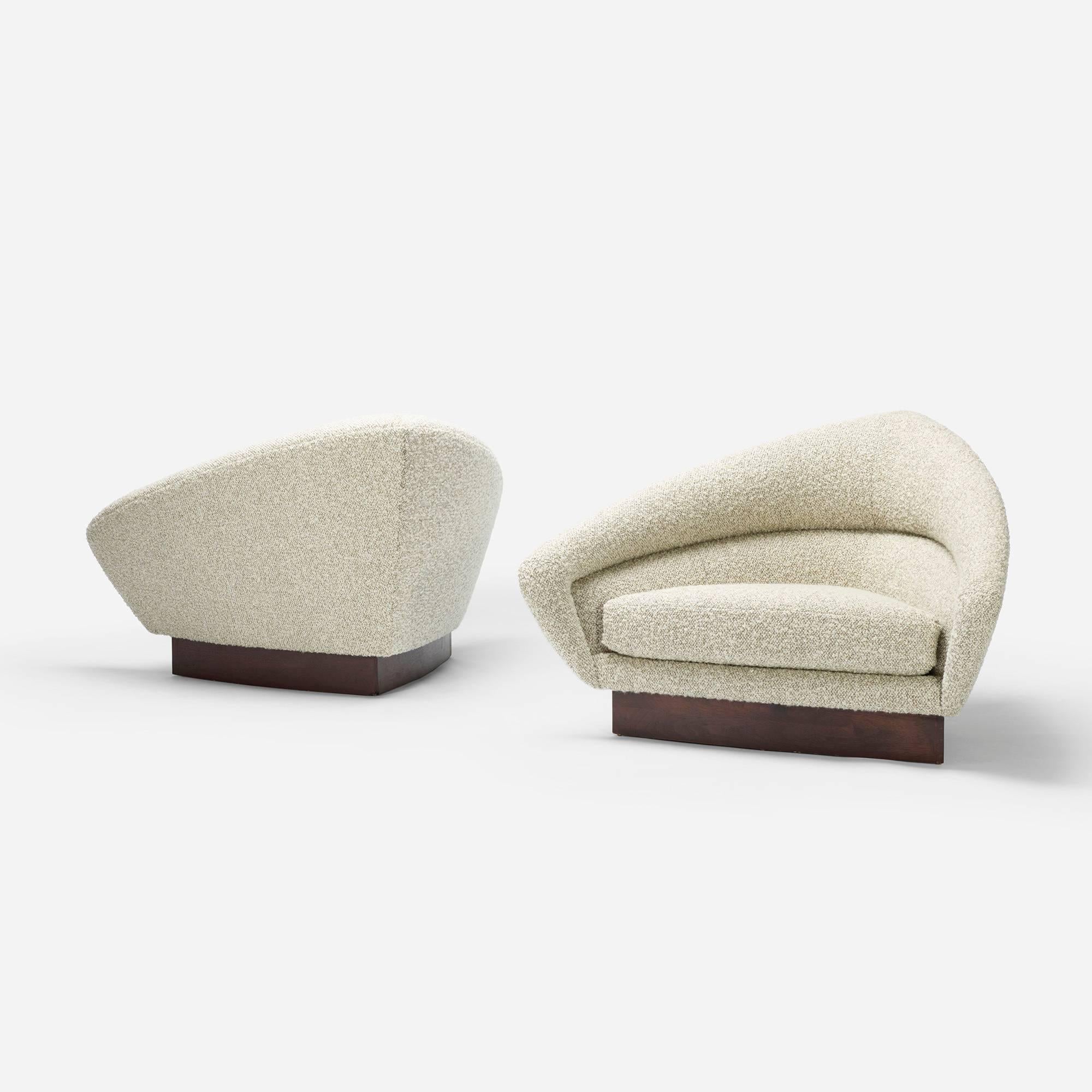 These V-shaped, low slung lounge chairs were recently reformed and recovered in a plush, sweater-like material giving them an incredibly cozy but sophisticated allure.