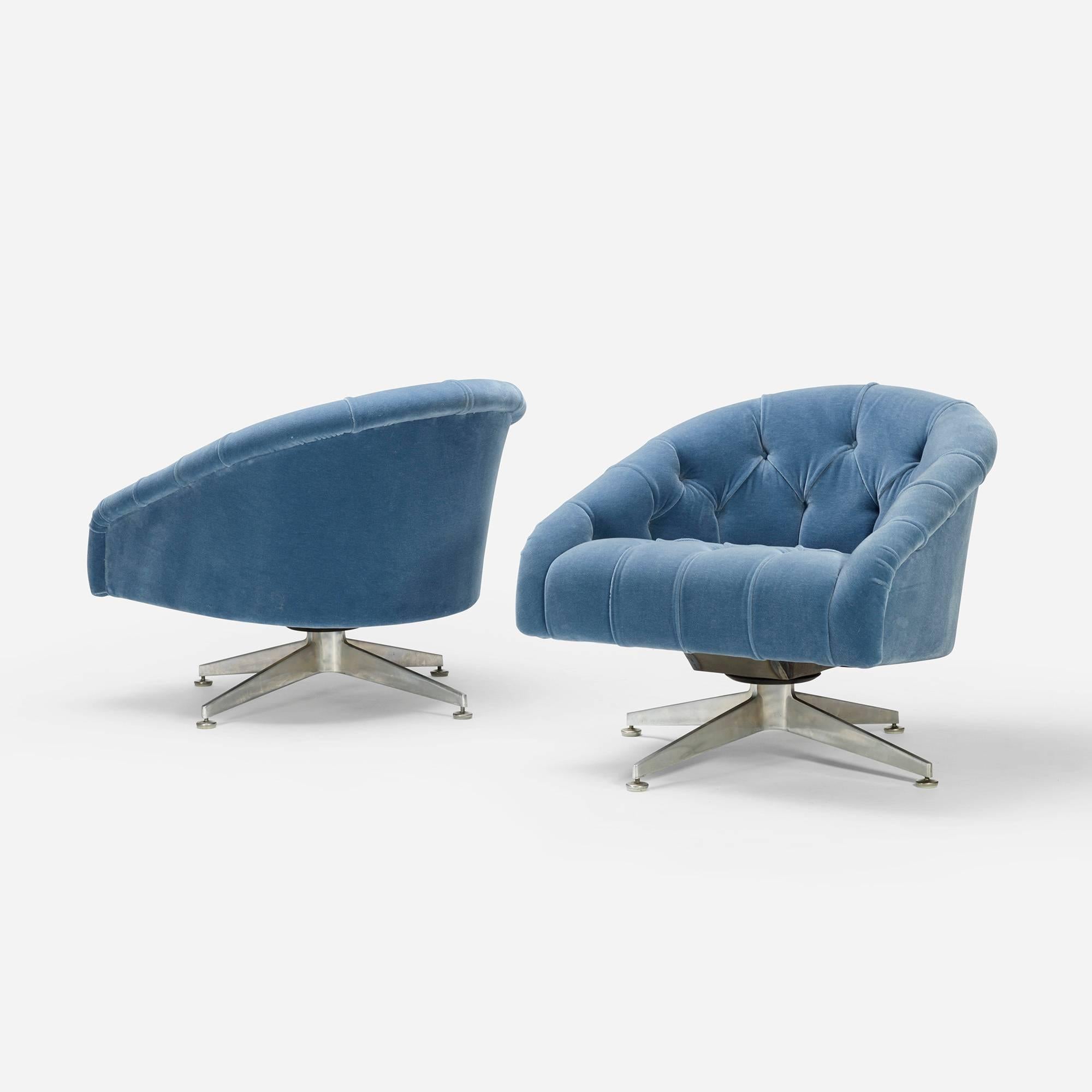 Compact, comfortable swivel chairs restored in a versatile blue mohair.