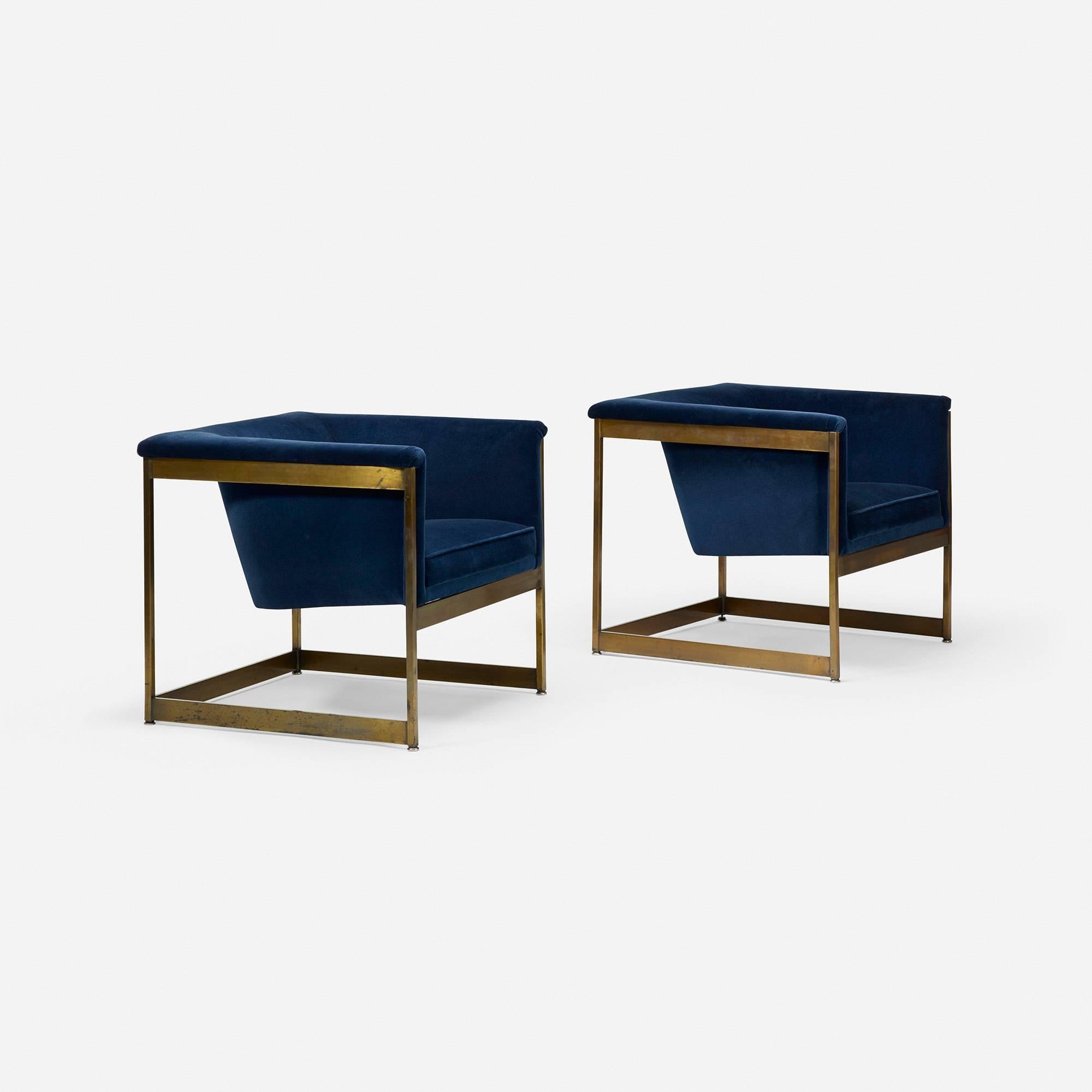 Stylish brass-coated lounge chairs by Milo Baughman. Recently reupholstered in a navy velvet fabric.