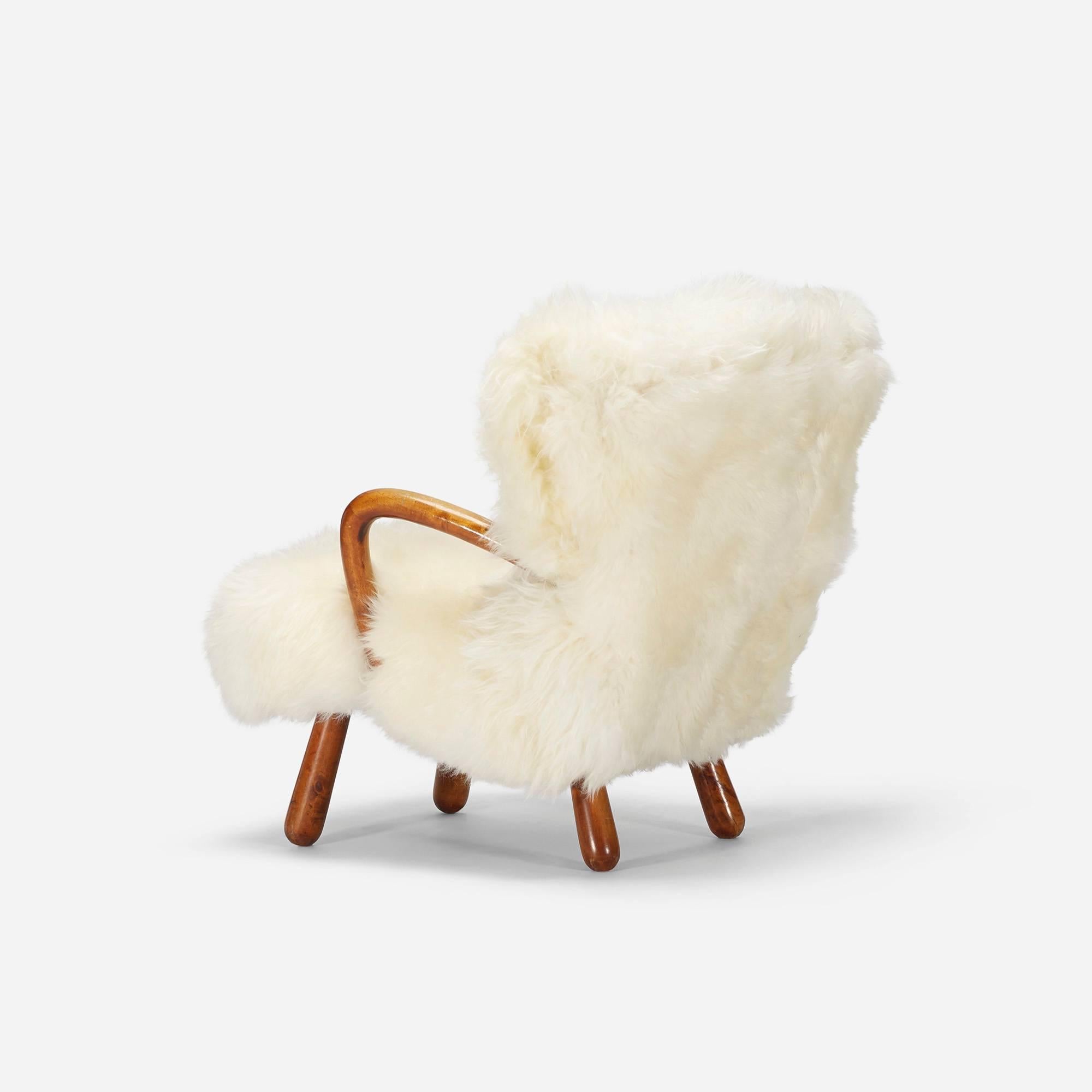 Swedish lounge chair upholstered in a soft, long-haired sheepskin.