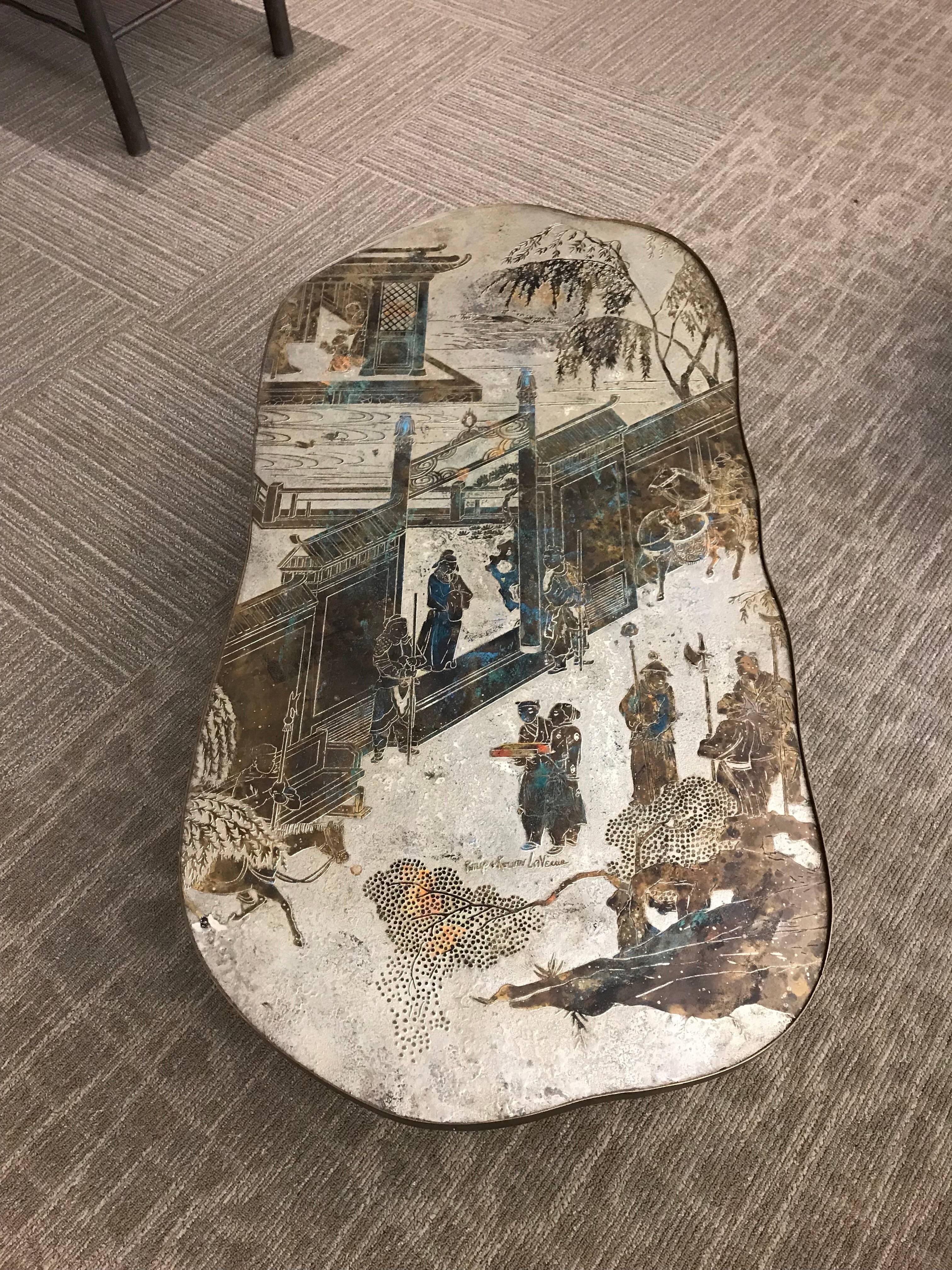 Organic shaped table by Philip and Kelvin LaVerne, circa 1970s, from the Chan series, with pavilions and figures in oxidized colors.