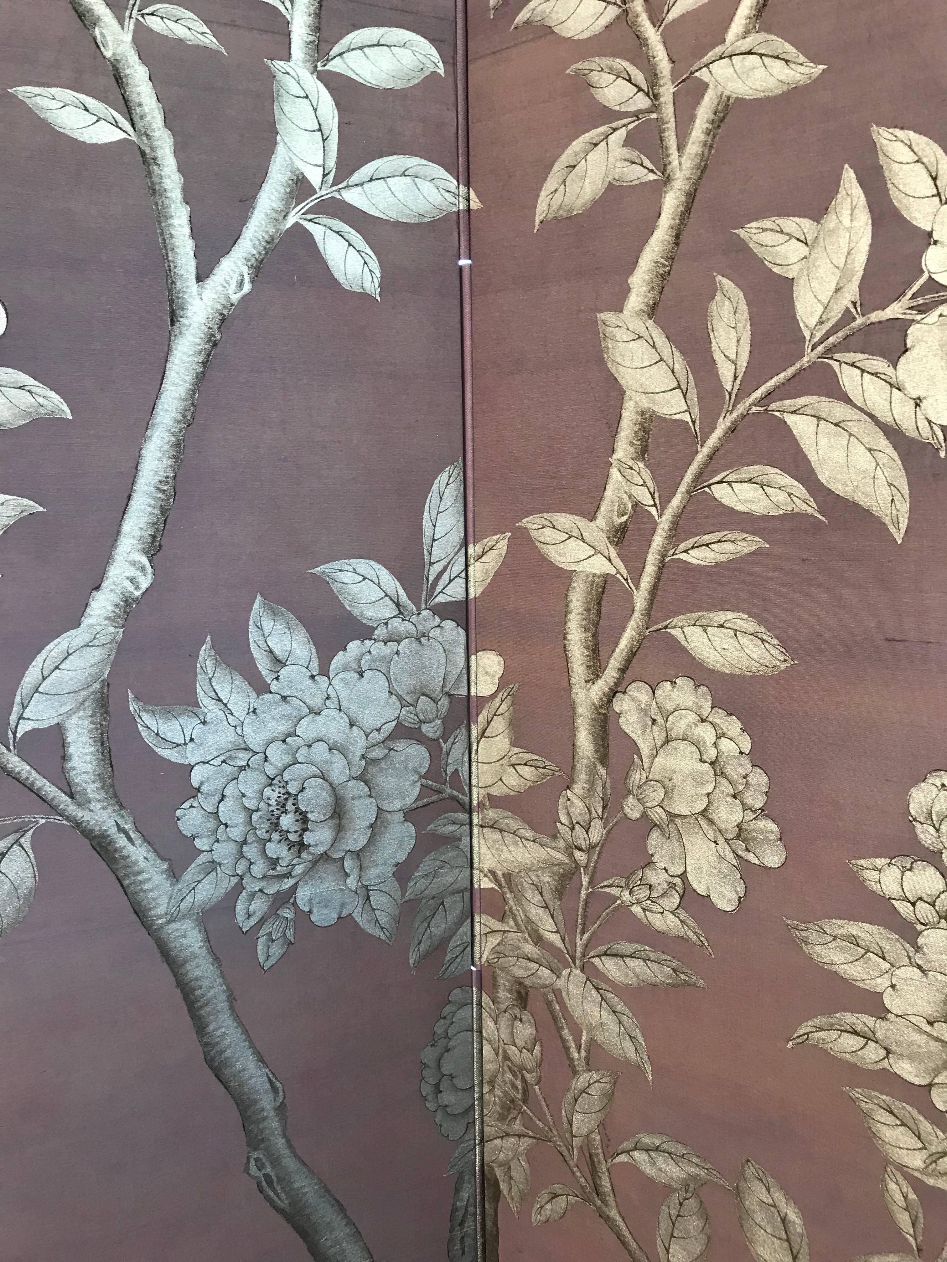 A luminous Gracie screen, with hand-painted design of flowering trees, birds and butterflies in silver with fine line details in black, on Lilac silk background. 

Silk is also applied on the back, and the design continues through the hinges.