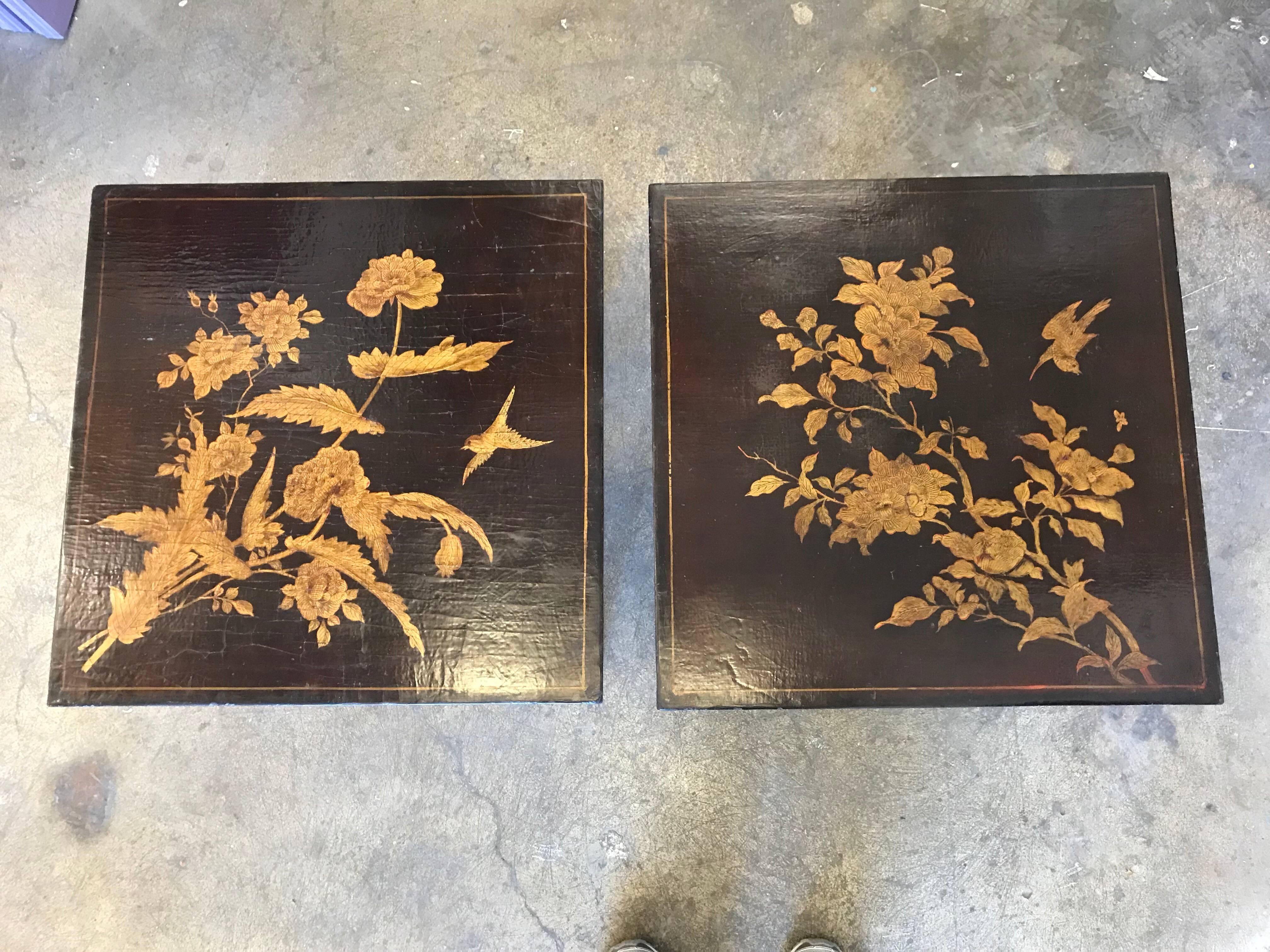 Pair of chinoiserie lacquered tables with metal bases.