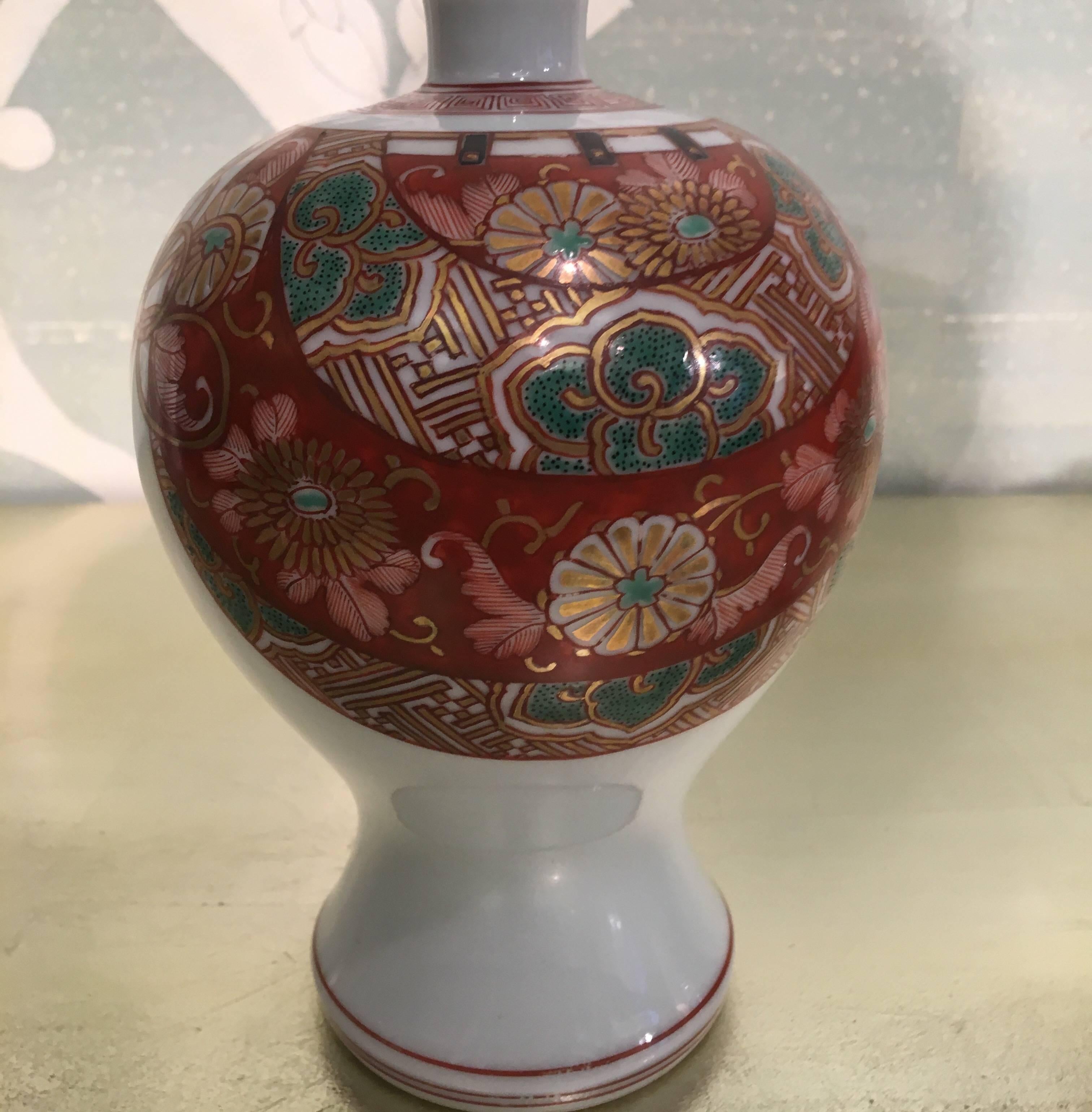 A vintage pair of Japanese bottle shaped vases.