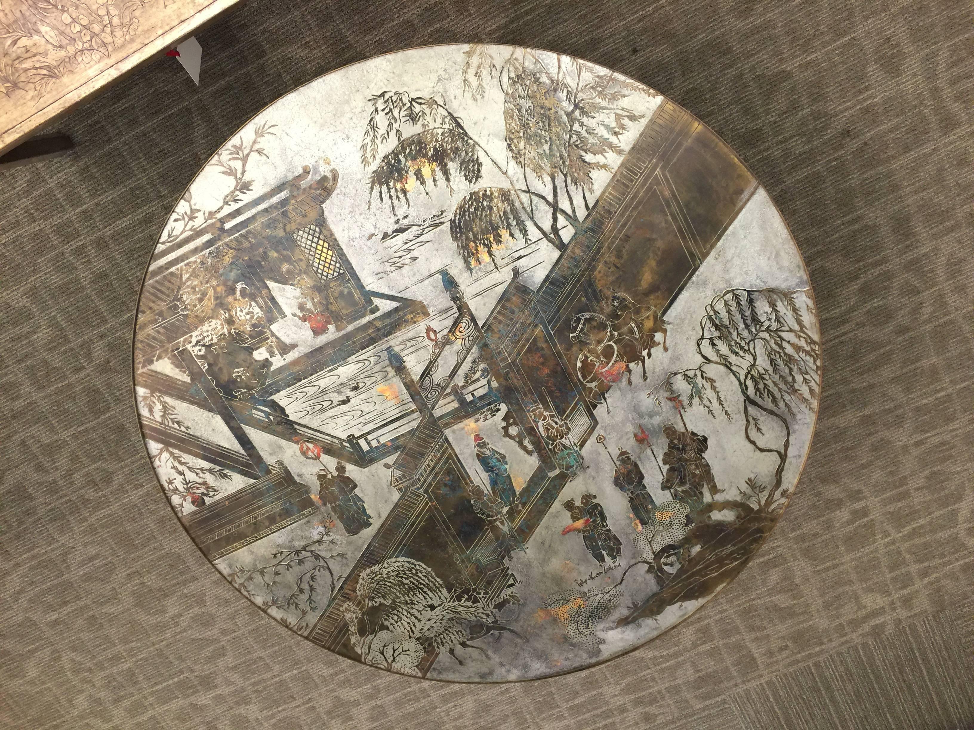 A wonderful round table by Philip and Kelvin LaVerne, with pedestal base.

This table is in fantastic condition and has very nice coloration and patina.

This table is from the Chan series and features Oriental figures in a landscape.

Signed