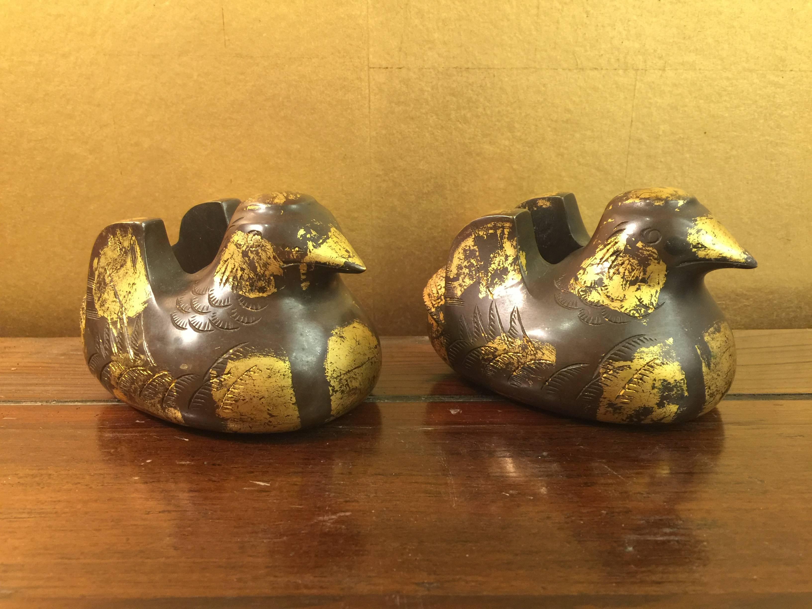 A wonderful pair of antique Japanese heavy bronze screen weights, in the shape of ducks, with touches of gilt.

These would have been used to support a Japanese screen, to prevent it from falling.

They are great sculptural pieces.