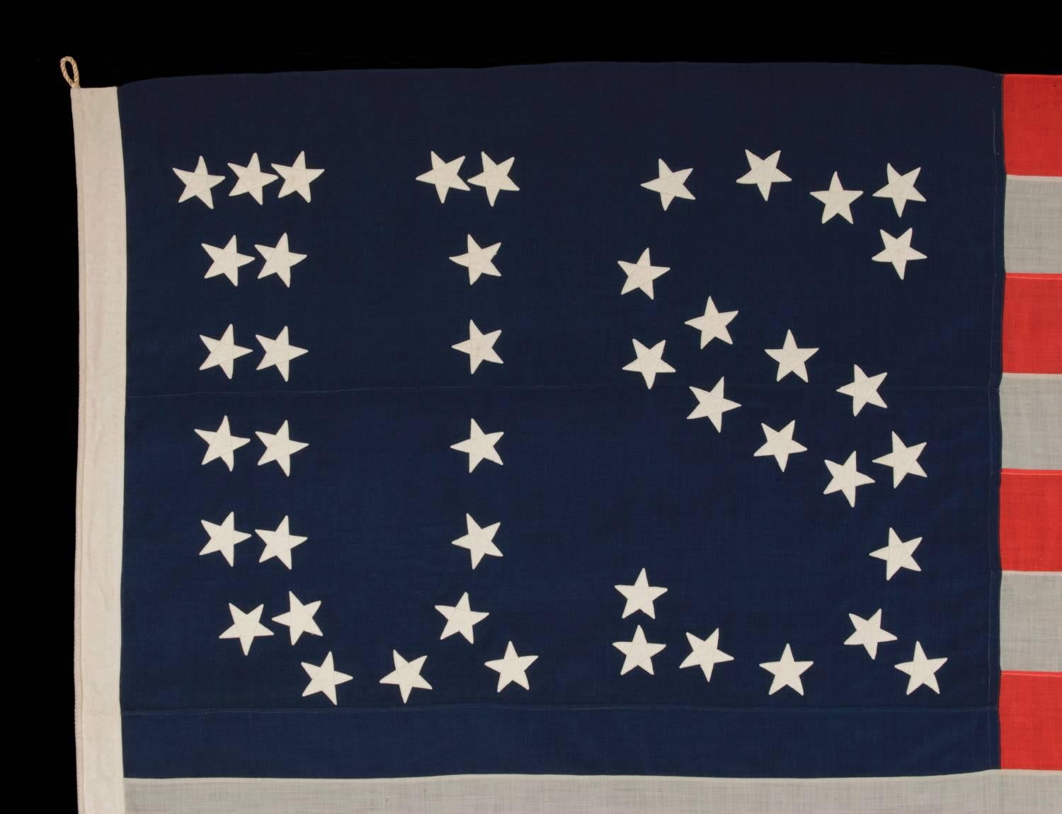 44 STARS CONFIGURED INTO THE LETTERS “U.S.”, PATENTED IN 1890 BY W.R. WASHBURN, ONE OF ONLY FOUR KNOWN SURVIVING EXAMPLES AND ONE OF THE BOLDEST DESIGNS KNOWN TO EXIST IN EARLY FLAGS:

Extremely rare 44 star American national flag with its stars