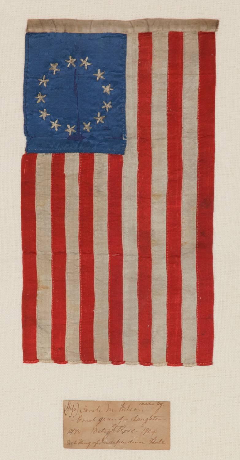 13 hand-embroidered stars and expertly hand-sewn stripes, on a flag made by Sarah M. Wilson, Great-granddaughter of Betsy Ross, in Philadelphia in 1904.

 13 star American national flag, entirely hand-sewn by Sarah M. Wilson, great-granddaughter