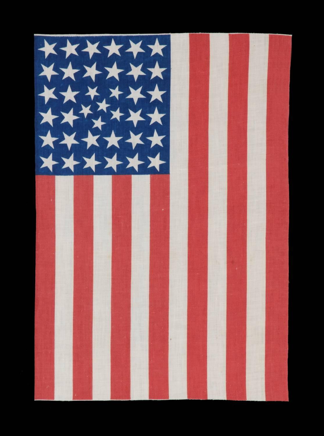 38 stars in a lineal arrangement that bears a cluster of six small stars within a lineal pattern of larger stars, 1876-1889, Colorado statehood:

38 star American national parade flag, printed on cotton. This is an extremely rare example of a