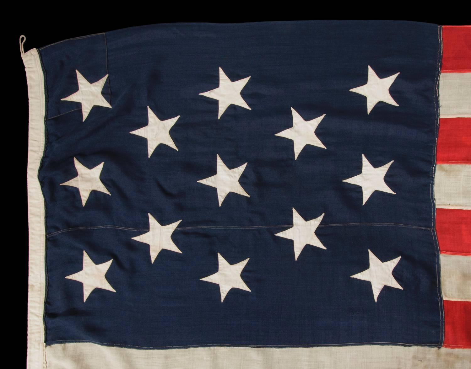 13 stars in a 3-2-3-2-3 lineal configuration on a large-scale flag made during the last quarter of the 19th century

13 star American national flag, made sometime between the nation's 100 year anniversary of independence and the year 1900. The