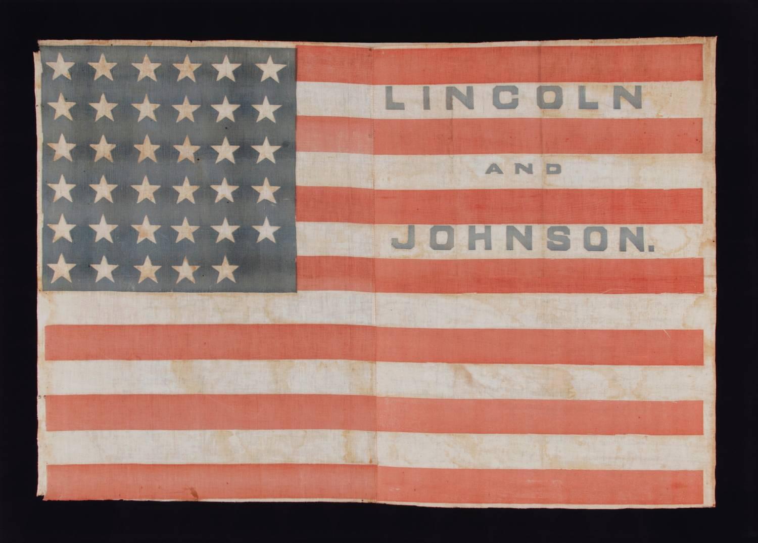 35 STARS IN A NOTCHED PATTERN ON A FLAG MADE FOR THE 1864 PRESIDENTIAL CAMPAIGN OF ABRAHAM LINCOLN & ANDREW JOHNSON; A MONUMENTAL EXAMPLE AND THE SECOND TO THE LARGEST KNOWN AMONG ALL CAMPAIGN PARADE FLAGS OF THE 19TH CENTURY, ACROSS ALL