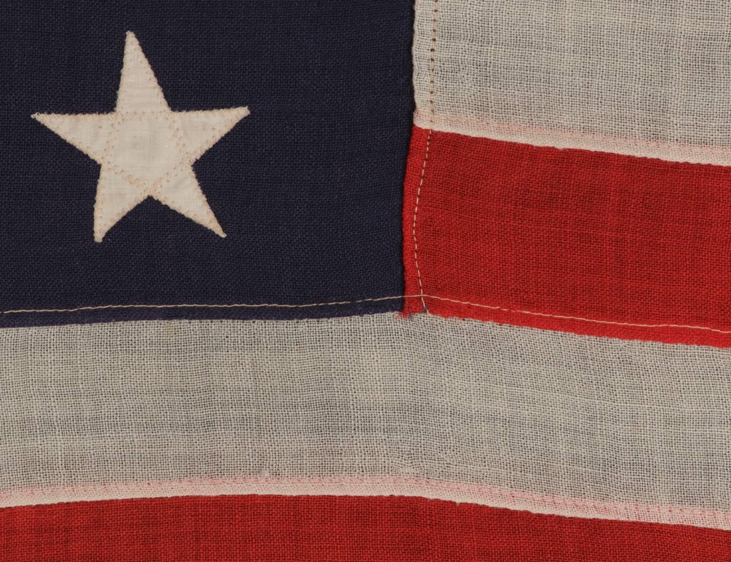 13 Stars Arranged in a 3-2-3-2-3 Pattern on a Small-Scale Antique American Flag 1