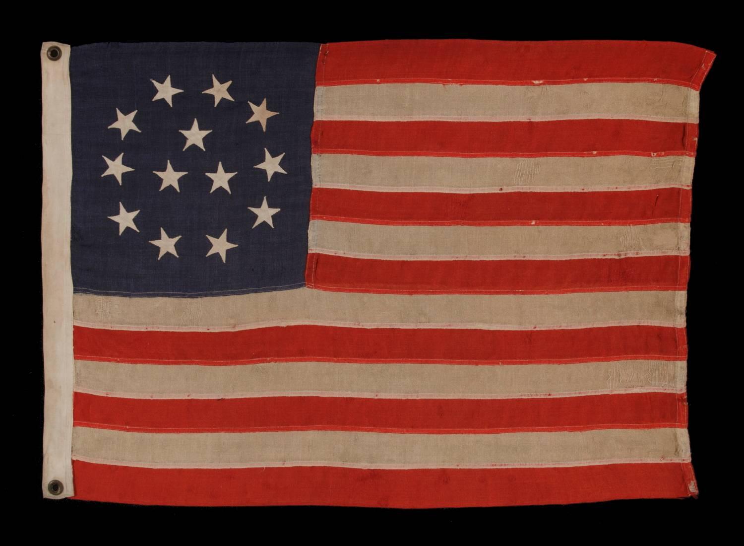 13 stars in wreath pattern with three center stars, one of the most rare 13 star flag designs known to exist, made by C.C. Fuller in Worcester, mass, 1890-1900:

13 star American national flag in a style known to have been made by Charles Chapman