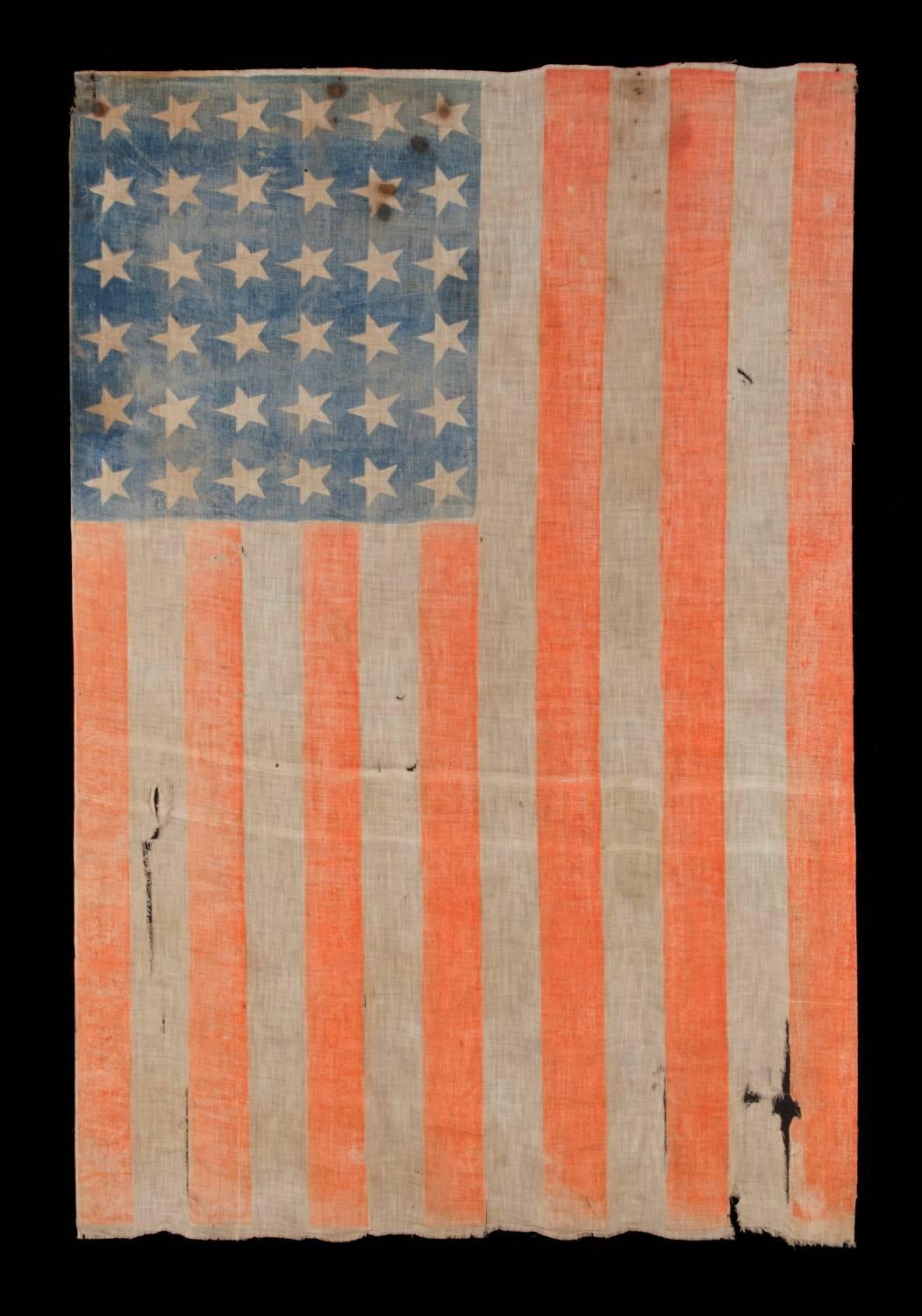 36 star antique American parade flag of the civil war era, in an especially large-scale and with endearing wear, 1864-1867, Nevada statehood:

36 star American national flag of the Civil War era, printed on coarse, glazed cotton. 36 star American
