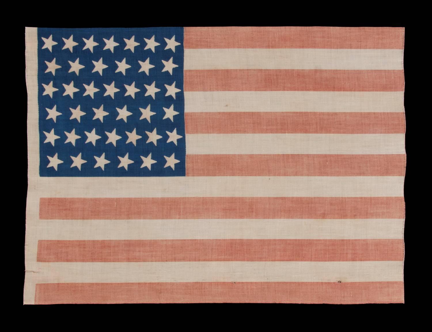 39 Tilted stars on an antique American flag with a royal blue canton, never an official star count, 1876-1889:

39 star American parade flag, printed on plain weave cotton. 39 star American national parade flag, printed on plain weave cotton. The