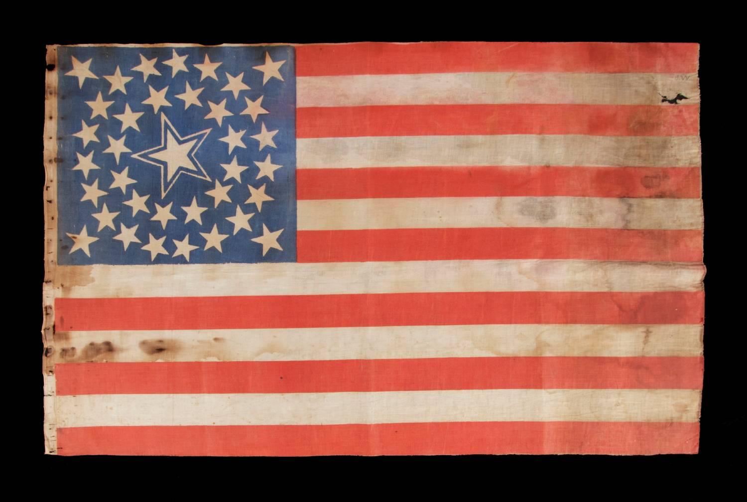 36 stars in a medallion configuration on a parade flag with a huge, haloed center star; a rare example, large in scale, Civil War era, Nevada statehood, 1864-1867.

 36 star American parade flag, printed on cotton and bearing a beautiful medallion