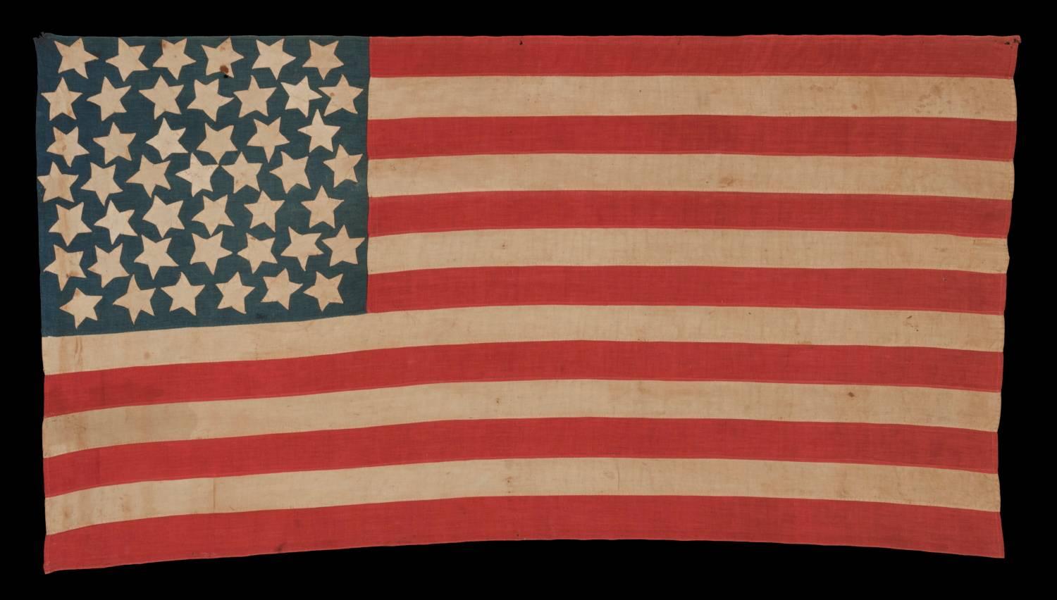 45 HAND-SEWN STARS ON A DENIM BLUE CANTON, WITH GREAT FOLK QUALITIES, ON A HOMEMADE FLAG OF THE 1896-1908 PERIOD, SPANISH-AMERICAN WAR ERA, UTAH STATEHOOD: 

45 star American national flag, made entirely of cotton and exhibiting wonderful folk