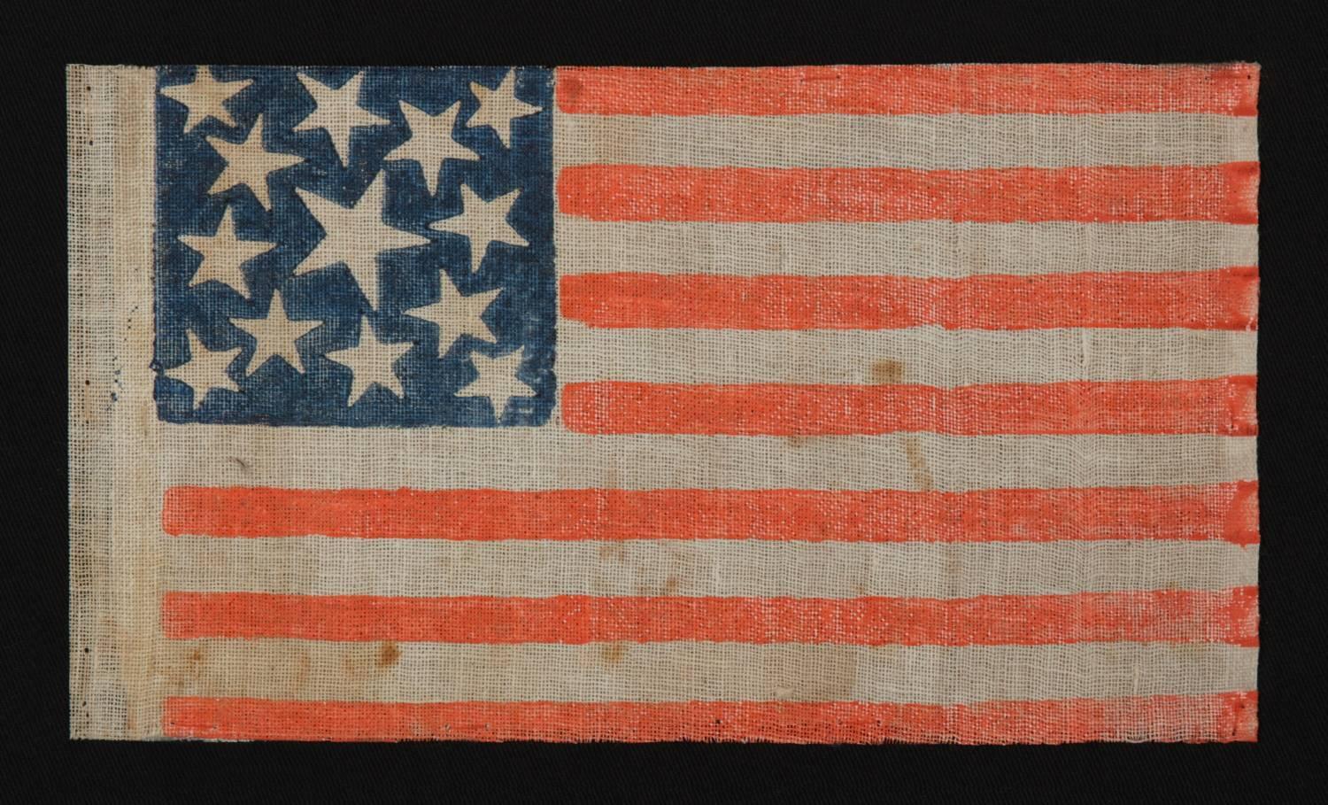 13 stars, 1861-1876 (civil war, centennial), featuring three sizes of stars in a medallion pattern:
 
13 star American national parade flag, printed on coarse, glazed cotton, with a wreath star design that incorporates three different sizes of