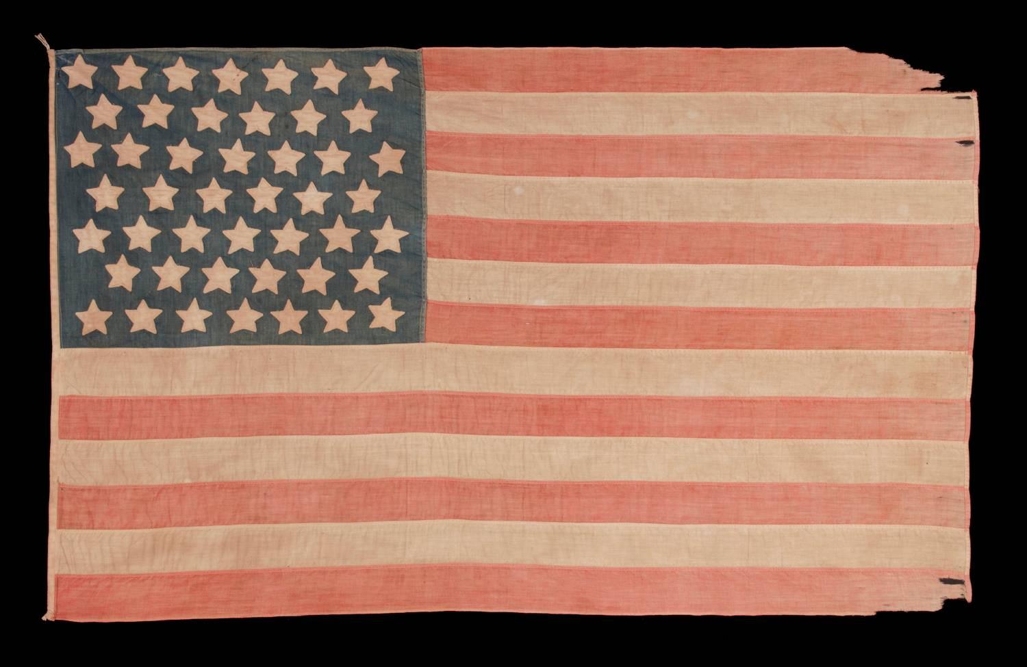 46 stars on a cotton flag with an unusual lineal pattern of stars in seven rows, probably of homemade origin, with beautiful wear and presentation, Oklahoma statehood, 1907-1912:

46 star American national flag, made entirely of cotton and with