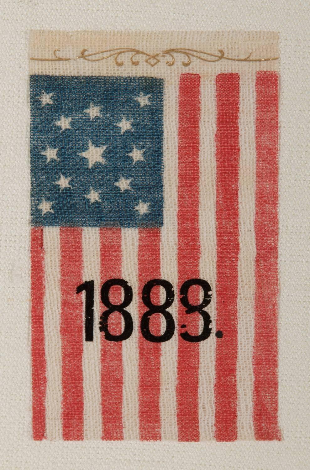 13 STAR, CENTENNIAL ERA, ANTIQUE AMERICAN PARADE FLAG WITH UNUSUAL OVERPRINTED 1888 DATE AND SCROLL WORK, PROBABLY MADE FOR A BENJAMIN HARRISON RALLY IN THIS PRESIDENTIAL ELECTION YEAR: 

13 star American national parade flag, printed on coarse,