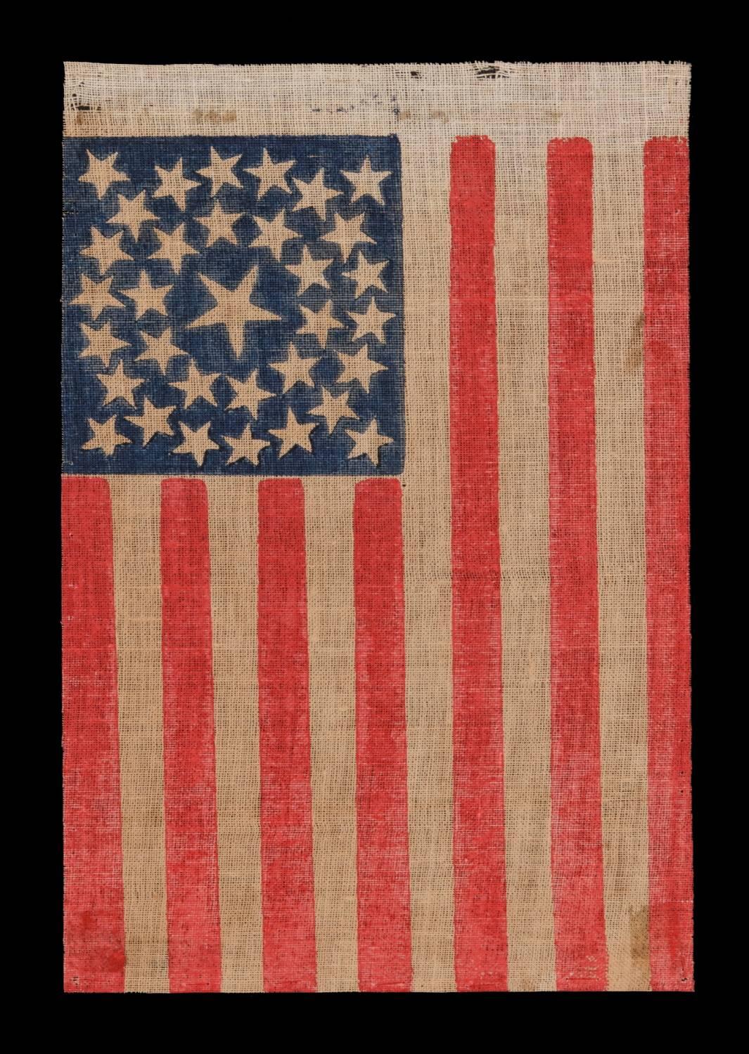 33 STARS, MEDALLION CONFIGURATION, PRE-CIVIL WAR THROUGH WAR PERIOD, 1859-1861: 

 33 star American national parade flag, printed on coarse, glazed cotton. The stars are arranged in a double wreath pattern with a large center star and 4 flanking