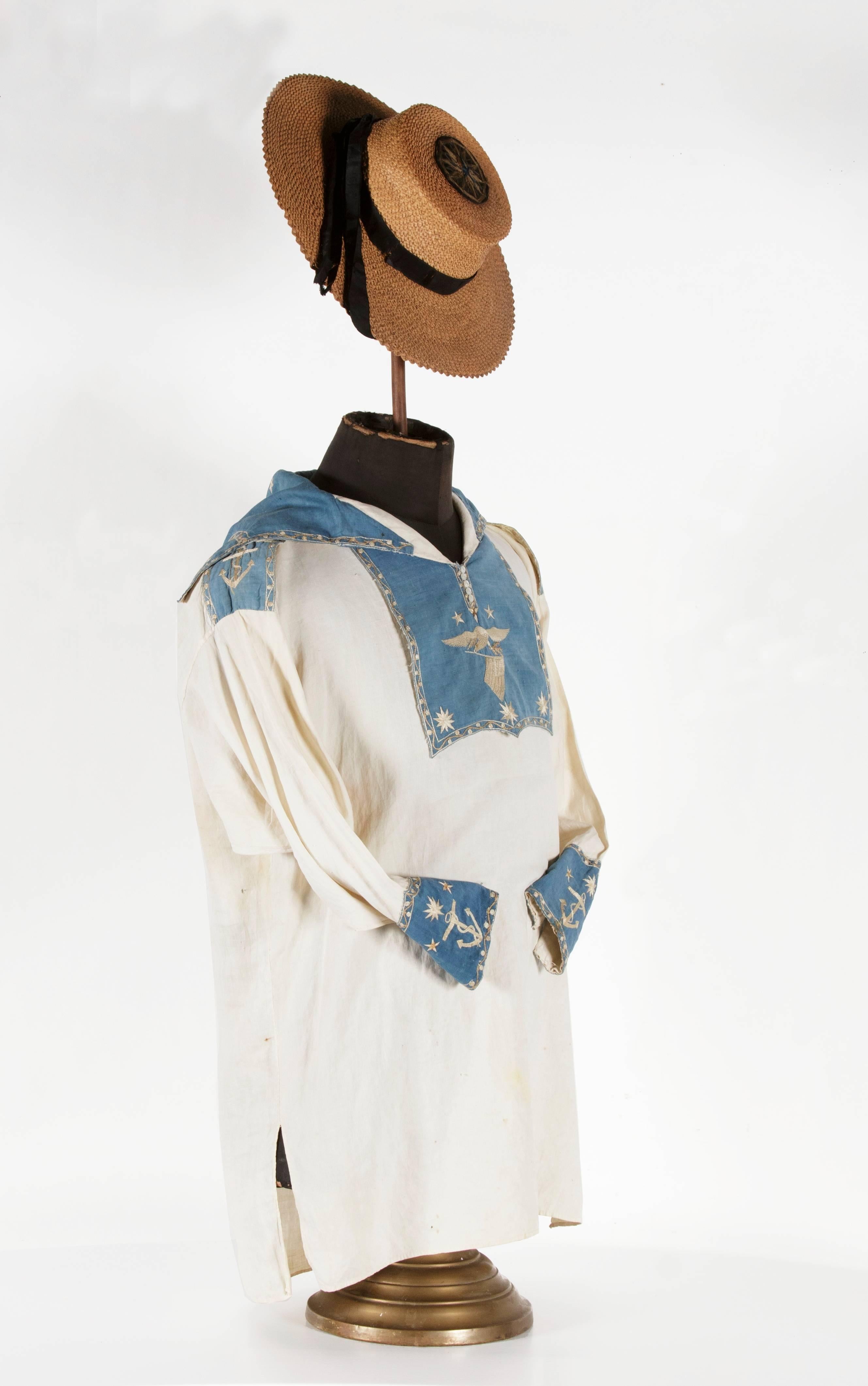 CIVIL WAR PERIOD OR PRIOR NAVYMAN’S FROCK AND JACK TAR HAT WITH ELABORATE PATRIOTIC AND NAUTICAL DECORATION, LIKELY THE BEST EXAMPLES OF EACH TO HAVE SURVIVED IN PRIVATE HANDS:

Sailor’s frock and Jack Tar style sennit, each of the Civil War period
