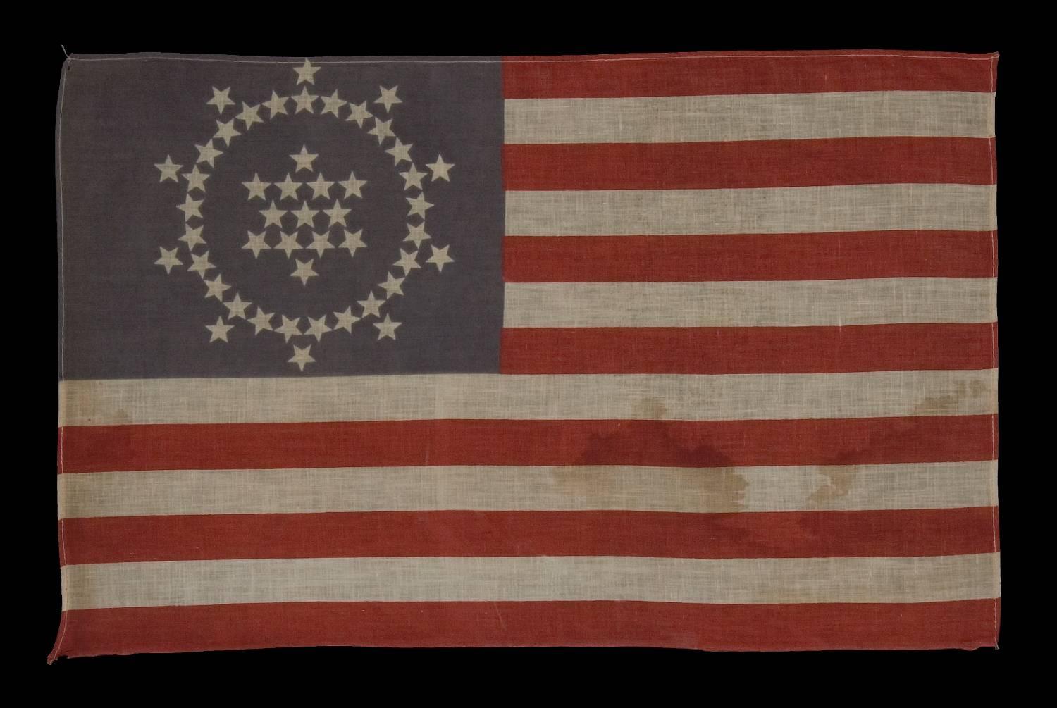 48 stars on an antique American flag designed and commissioned by Wayne Whipple, 1910-1912, a rare and highly desired example:

Many people are not aware that for the first 135 years of the existence of the American national flag, there was no