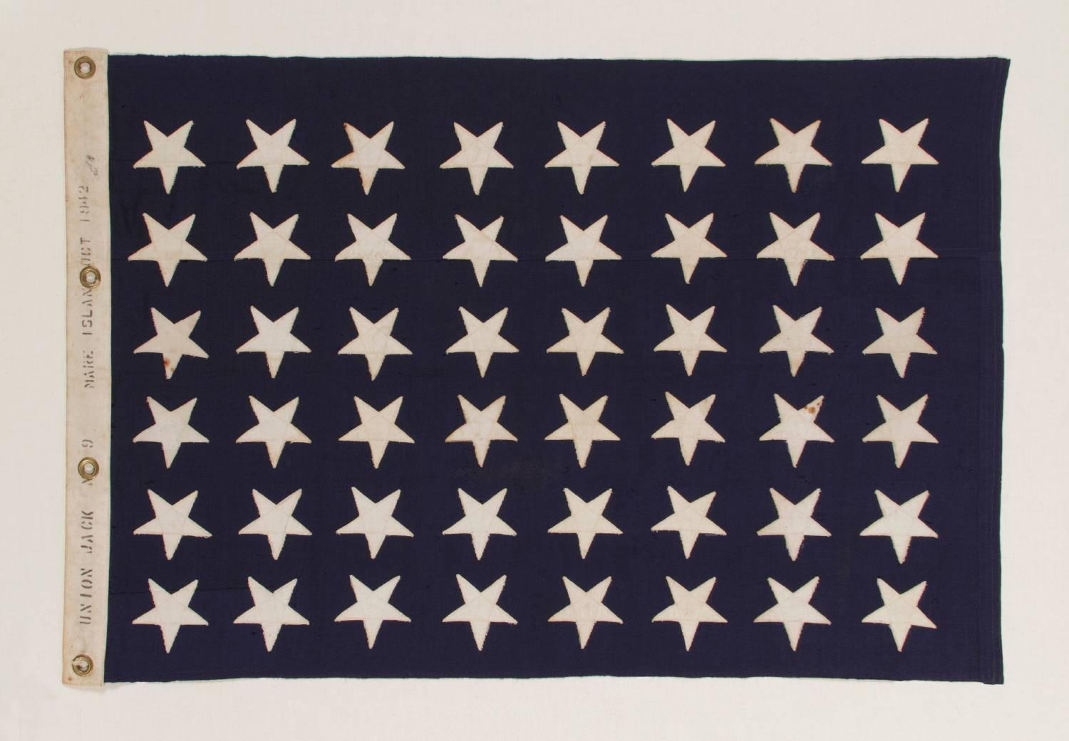 48 STAR U.S. NAVY JACK, MADE AT MARE ISLAND, CALIFORNIA, HEADQUARTERS OF THE PACIFIC FLEET, DURING WWII, DATED 1942:

United States Navy jack with 48 stars, made during WWII (U.S. involvement 1941-45) at Mare Island, California, Headquarters of the