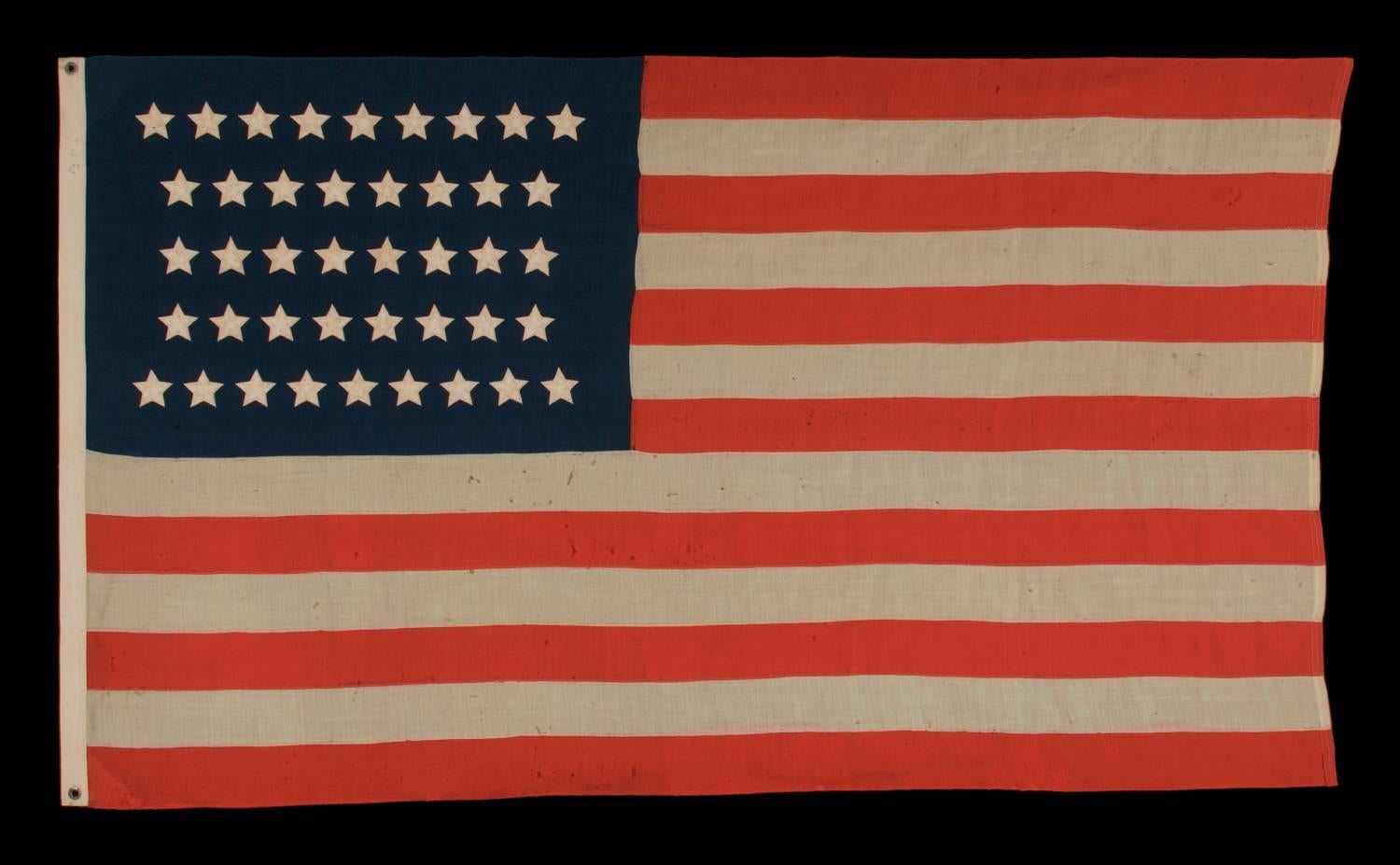 42 STARS IN AN HOURGLASS PATTERN ON AN ANTIQUE AMERICAN FLAG, AN UNOFFICIAL STAR COUNT, WASHINGTON STATEHOOD, 1889-1890:

Early American national flag with 42 stars, configured in rows of 8-7-7-7-7-8. Note how the top and bottom rows offset in such