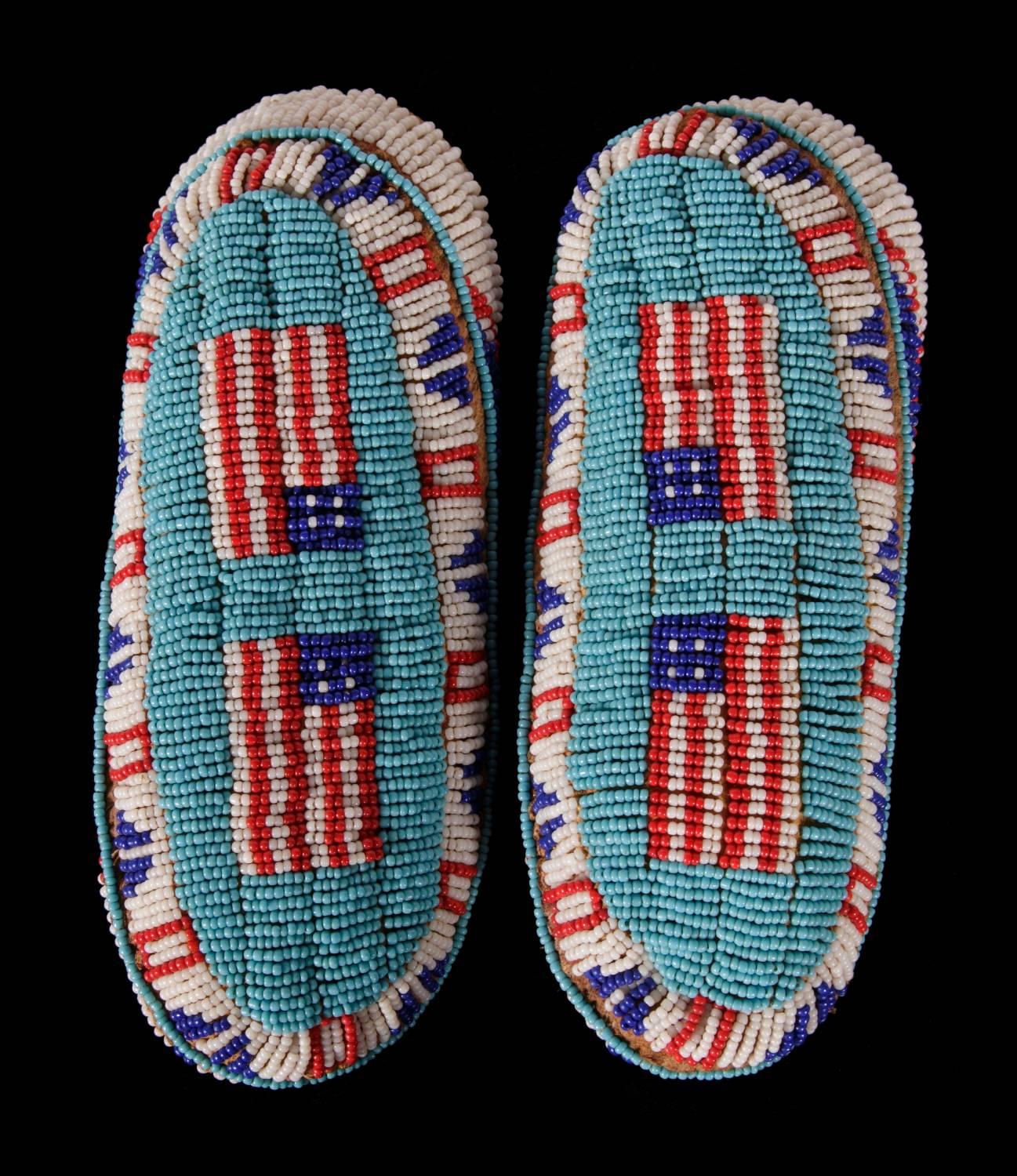 Native American child's moccasins with flag imagery, probably Sioux, circa 1890:

Native American child's moccasins, made from hide with elaborate patriotic beadwork, circa 1890. The colorful imagery includes opposing pairs of American flags, each