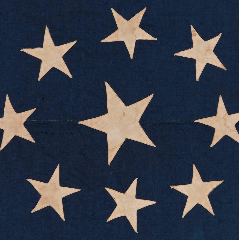 13 STAR JACK WITH A SUPERELLIPSE VARIANT OF A DIAMOND CONFIGURATION THAT IS UNIQUE AMONG KNOWN 13 STAR FLAGS, PROBABLY MADE FOR A HUDSON RIVER PADDLE WHEEL STEAMER, CA 1880-1895:

A jack is a flag traditionally flown on a military ship. Like the