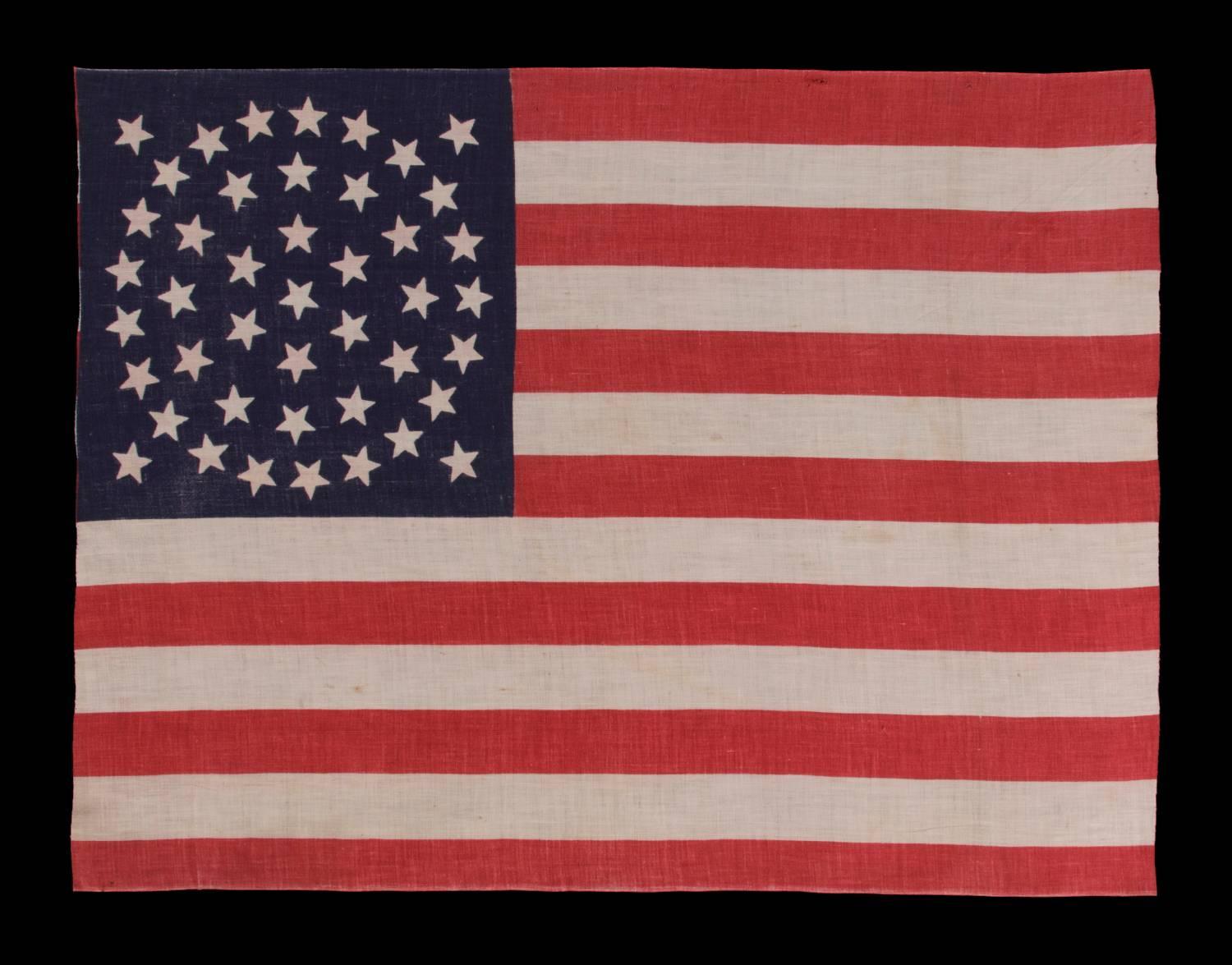 44 STARS ON A LARGE SCALE PARADE FLAG, WYOMING STATEHOOD, 1890-1896, RARE IN THIS PERIOD WITH A WREATH CONFIGURATION:

44 star American parade flag with triple wreath medallion star configuration, printed on cotton. This highly desired star pattern