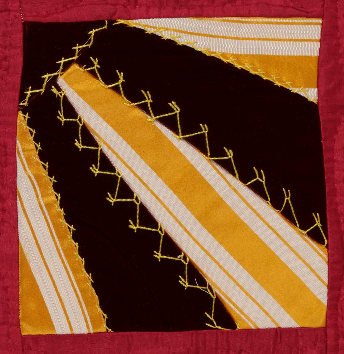 Unusual fan quilt with piecework that resembles neck ties or sun rays.  Made from ribbon silks and velvets, circa 1870-1890.  Lancaster County, Pennsylvania origin.  Probably Mennonite.  A masterpiece of Pennsylvania German folk art.

Mounting: 