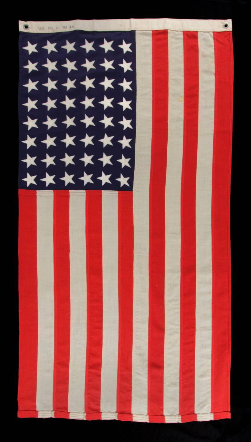 48 star, U.S. Navy small boat ensign, made at Mare Island, California during WWII, signed and dated 1944:

 48 star American national flag, made during World War II (U.S. involvement 1941-45) and signed along the reverse side of the hoist with a