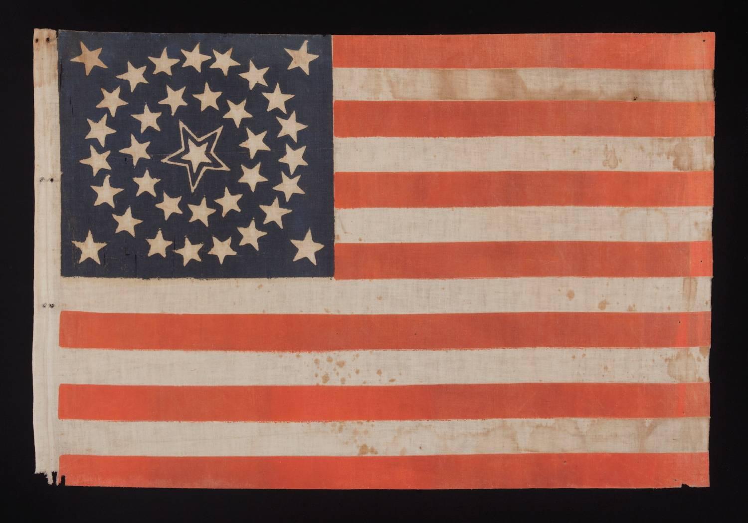 35 stars in a medallion configuration with a large, haloed center star, 1863-65, Civil War period, West Virginia statehood:

35 star American national parade flag, printed on cotton and bearing a beautiful medallion configuration that has a huge,