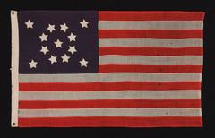 13 Star Flag, With Short, Conical Arms And Stars In A Medallion Configuration