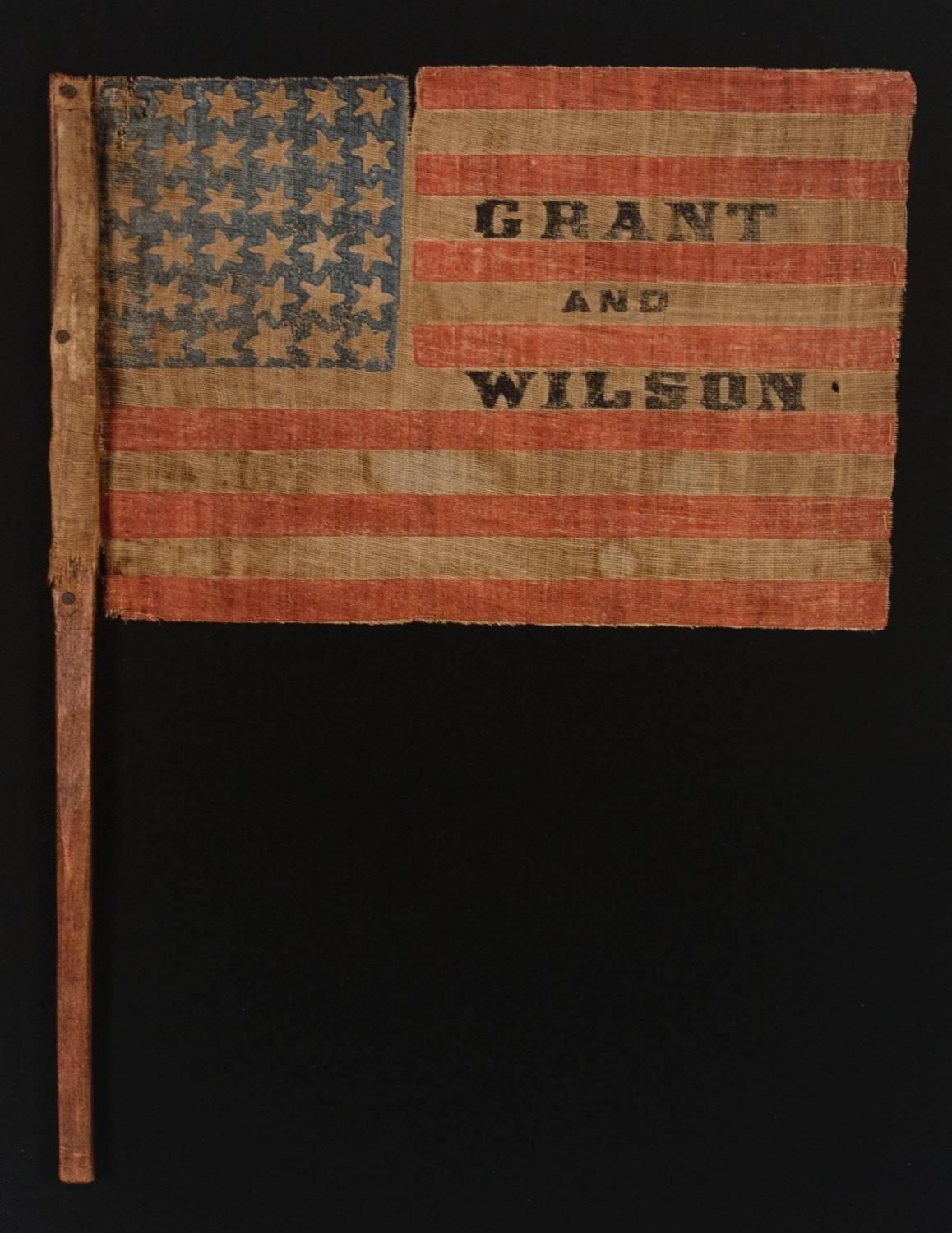 EXTREMELY RARE, 36 STAR, OVERPRINTED PARADE FLAG, MADE FOR THE 1872 PRESIDENTIAL CAMPAIGN OF ULYSSES S. GRANT & HENRY WILSON, ON ITS ORIGINAL, CARVED WOODEN STAFF:

36 star parade flag, printed on coarse, glazed cotton, made for the 1872