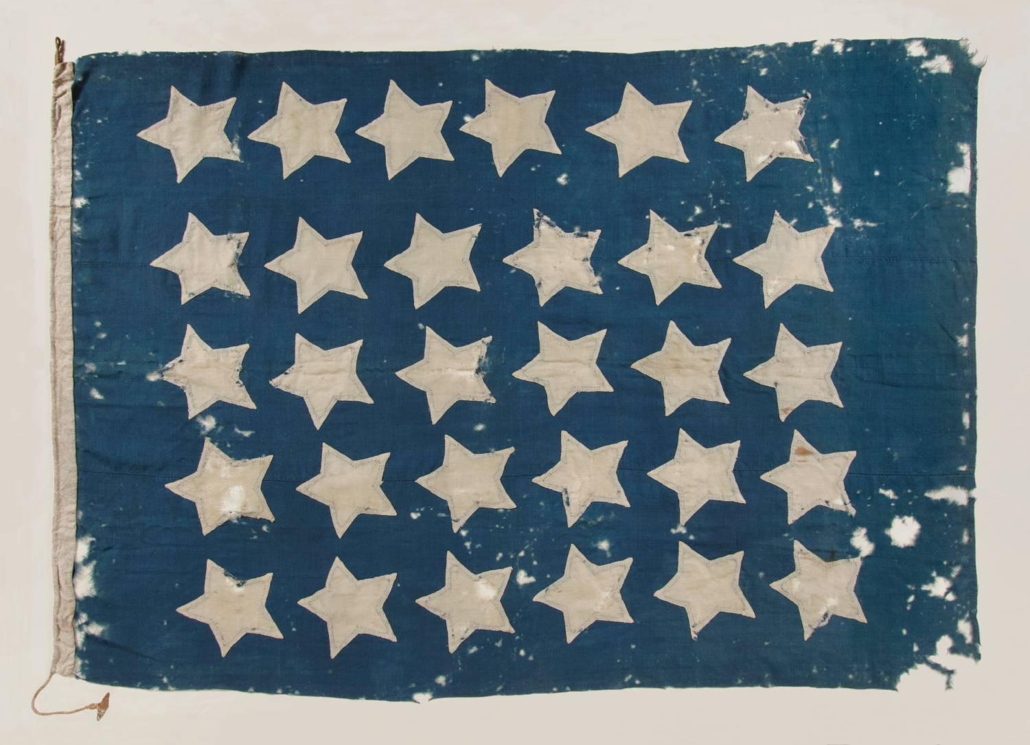 U.S. NAVY JACK WITH 30 STARS, AN ENTIRELY HAND-SEWN, PRE-CIVIL WAR EXAMPLE WITH GREAT COLOR AND BOLD VISUAL QUALITIES, WISCONSIN STATEHOOD, 1848-1850:

Like the British Royal Navy, American vessels flew three flags. When at anchor or moored, the