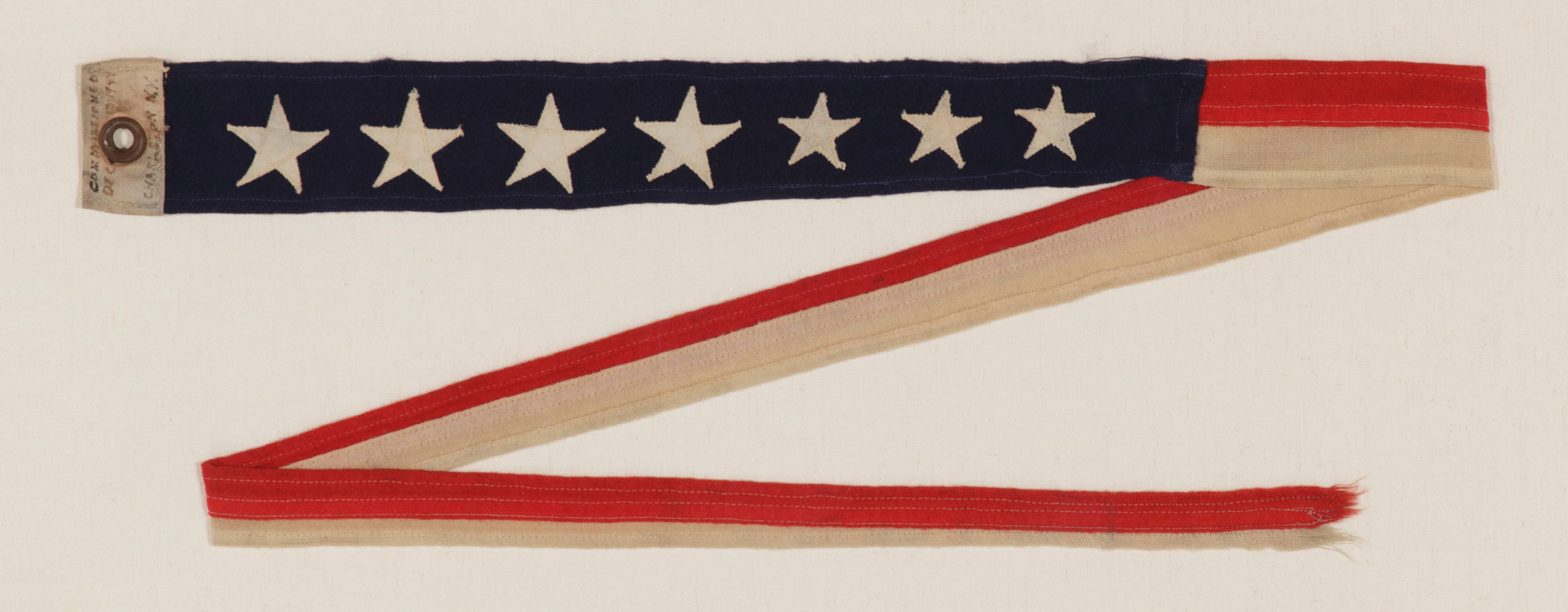 WWII U.S. NAVY COMMISSIONING PENNANT FROM THE U.S.S. CASWELL, TOLLAND-CLASS ATTACK CARGO SHIP, COMMISSIONED DEC. 13, 1944, THAT PARTICIPATED IN OKINAWA IN SUPPORT OF THE 6TH MARINES:

 7 star U.S. Navy commissioning pennant from the U.S.S. Caswell