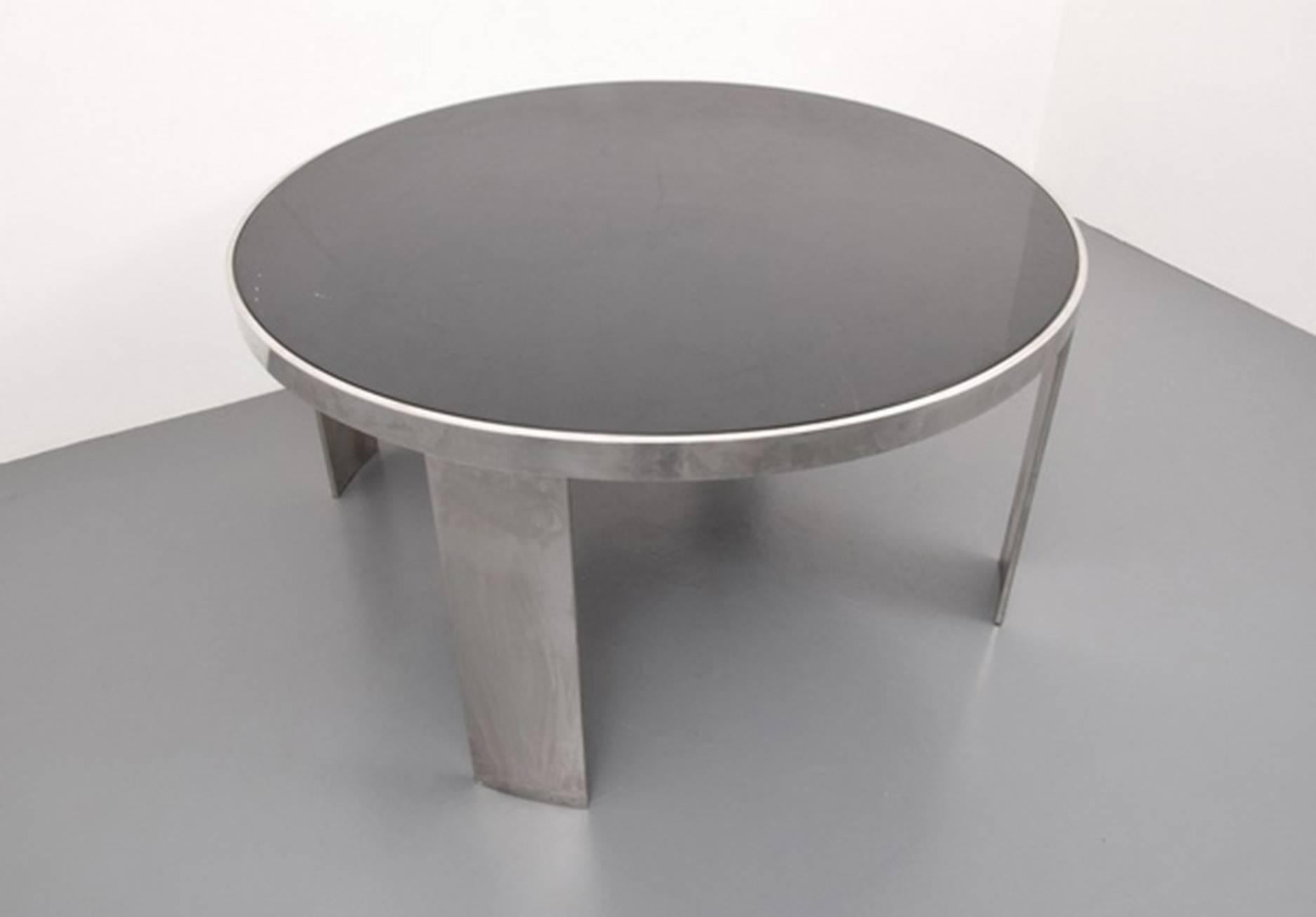Very nice Mid-Century Modern dining table. The finish appears to be chromed metal, enameled wood or possibly plastic.