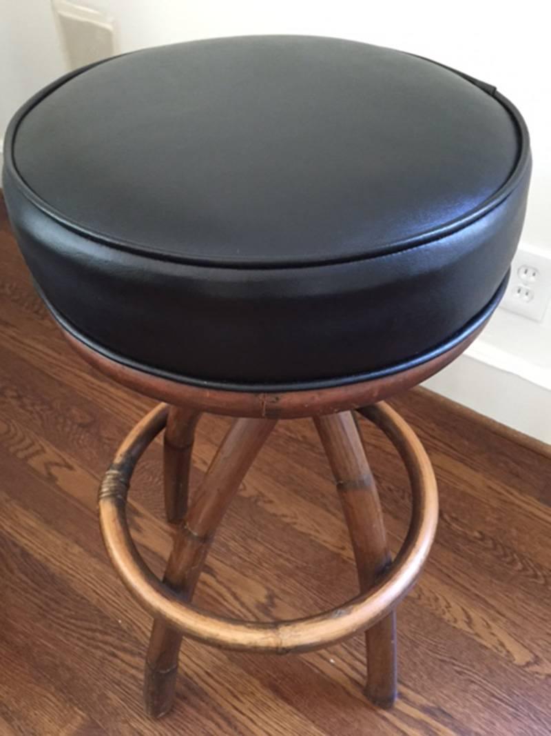Classic Mid-Century Modern bamboo bar stools upholstered in black leather. Very unique and comfortable for your bar or breakfast counter.