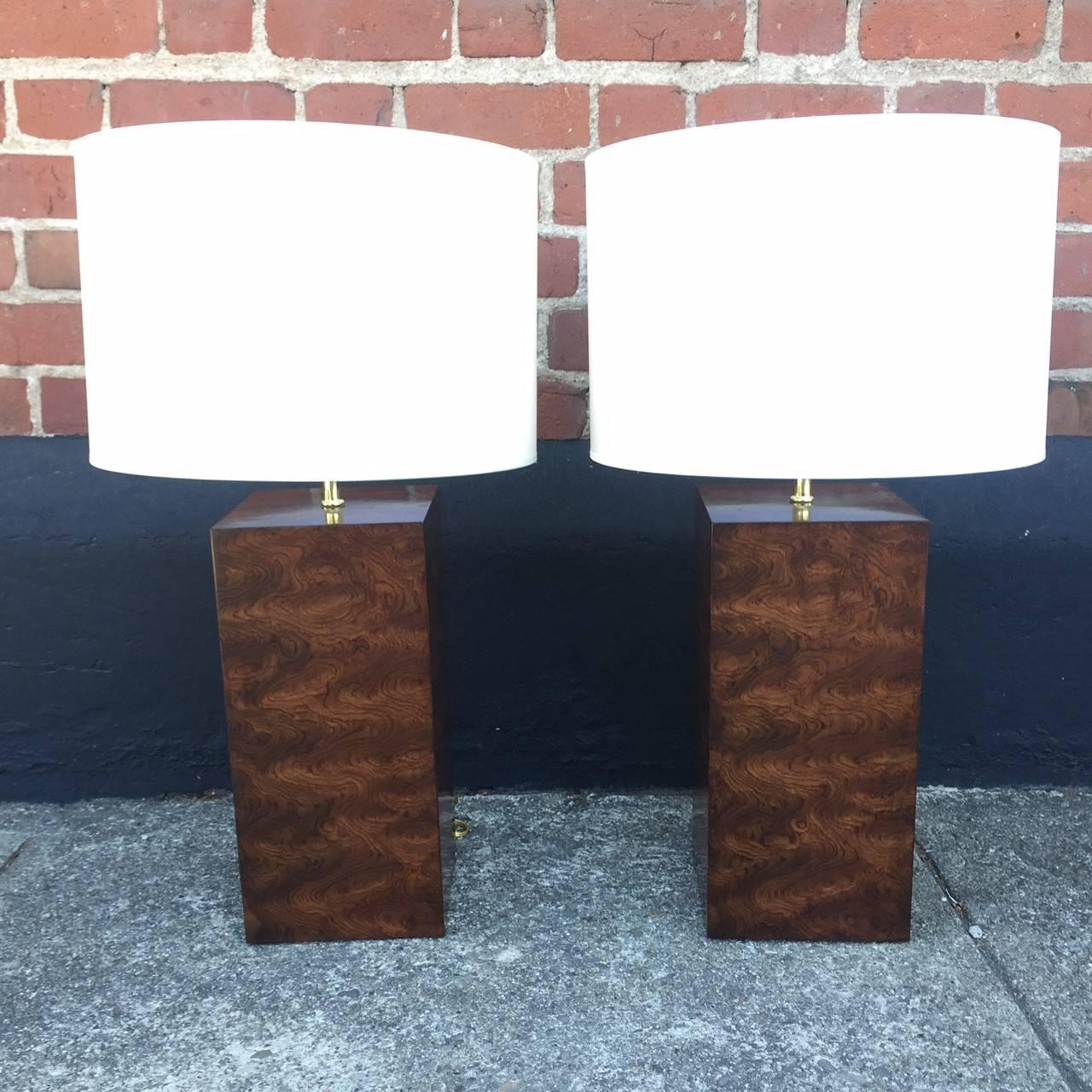 A beautiful pair of burl wood block lamps, sure to set the stage in any room.

 Dimensions: 7